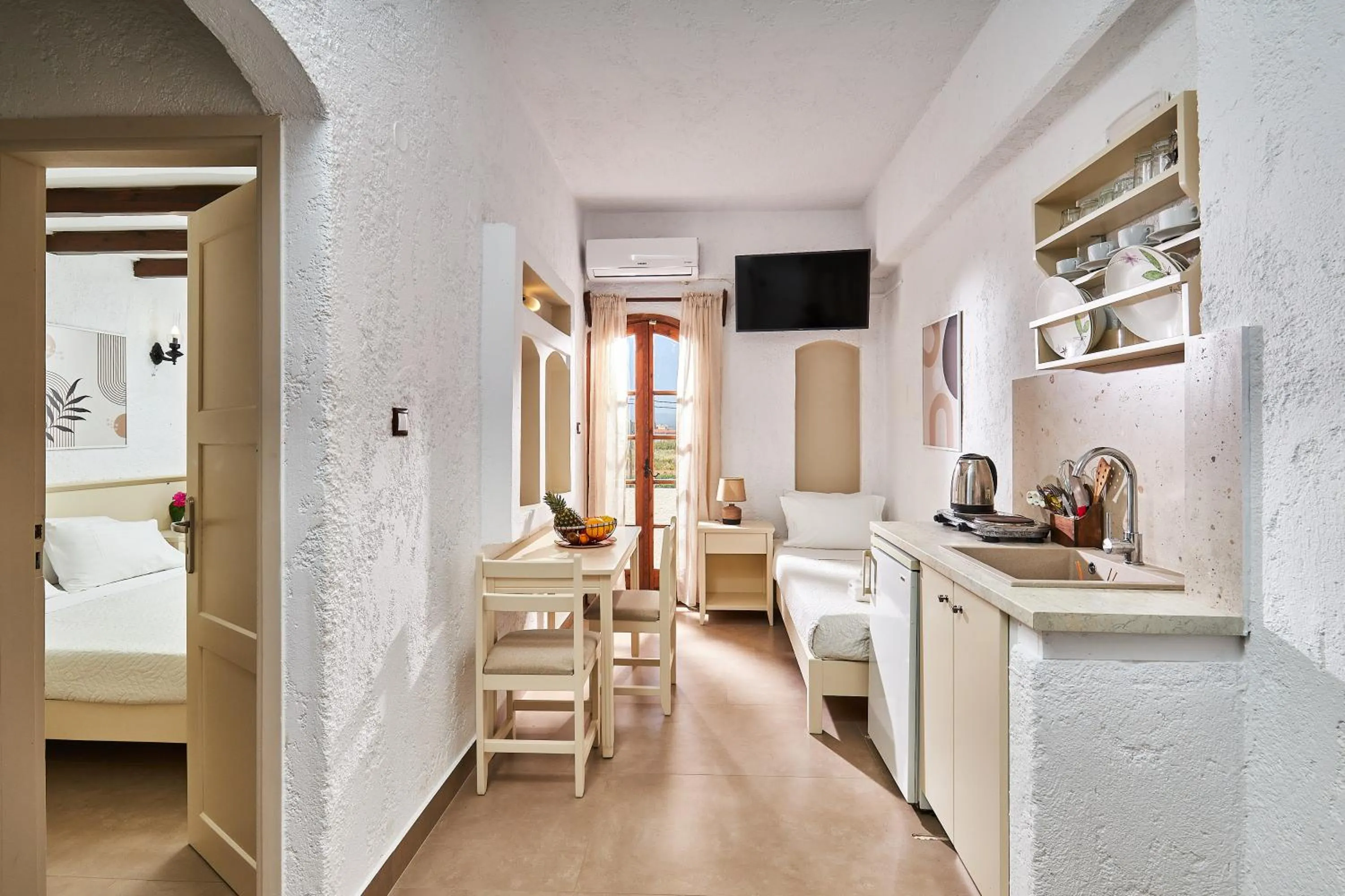 Bed in Mila Malia Studios Hotel