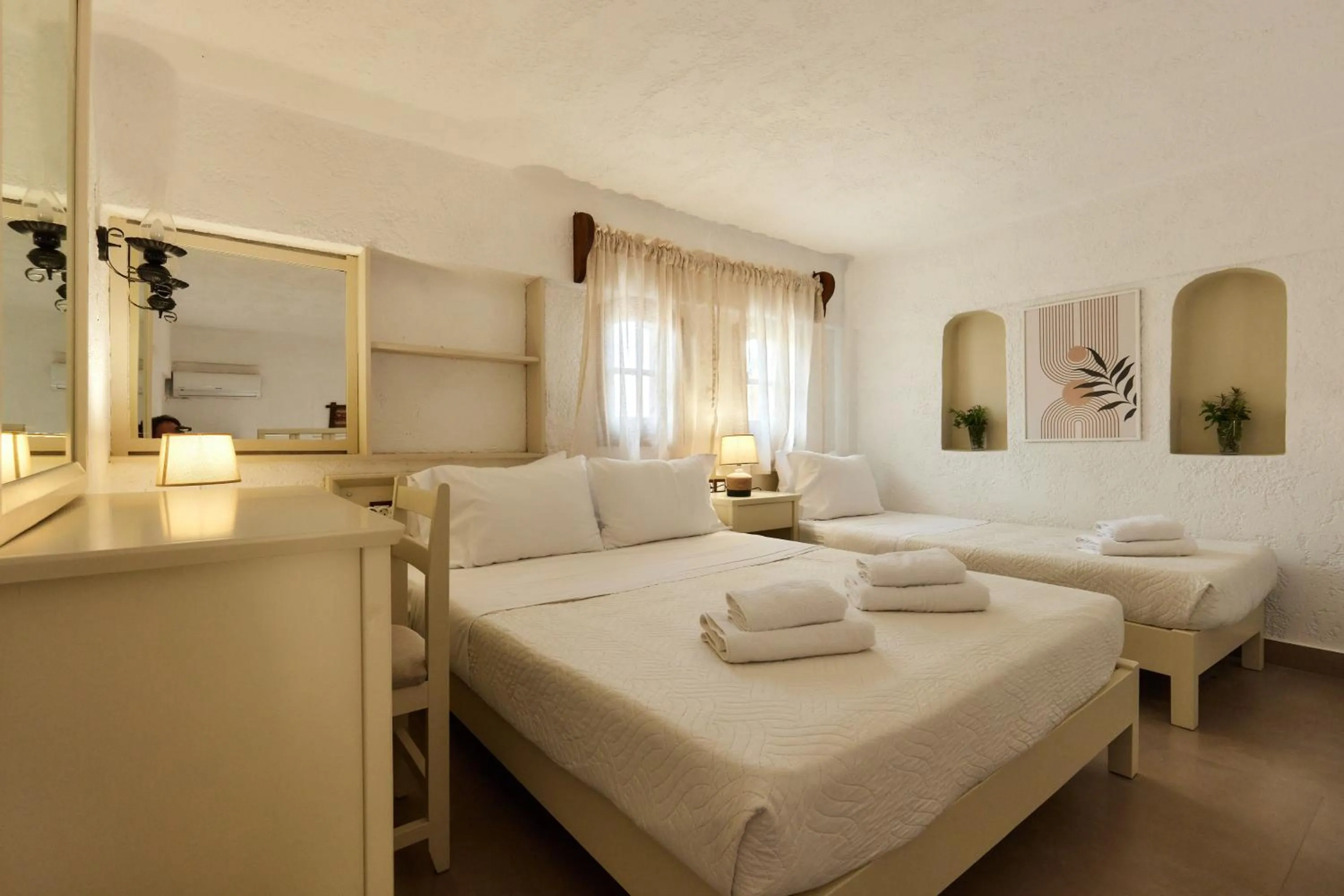 Bed in Mila Malia Studios Hotel