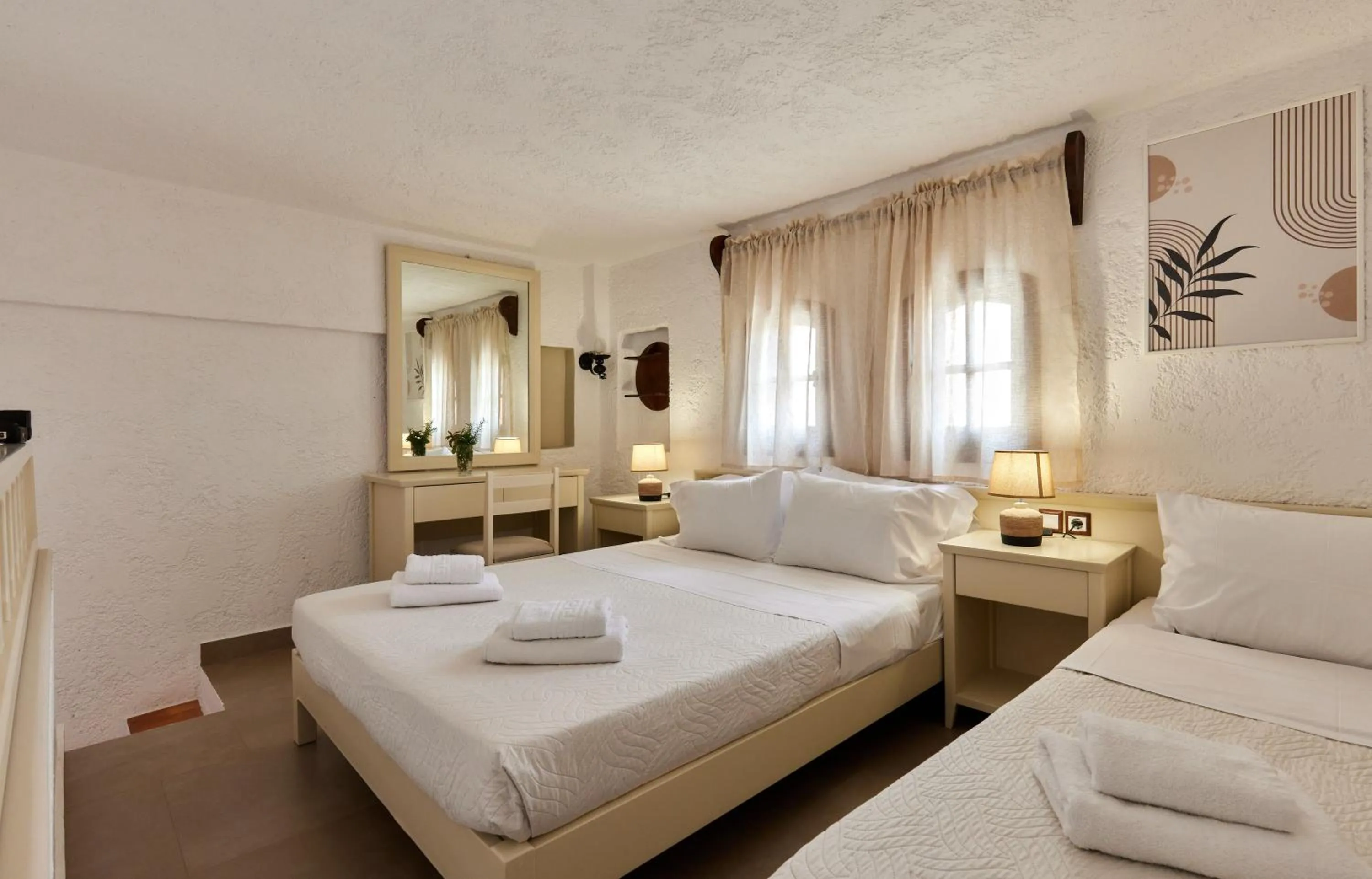 Bed in Mila Malia Studios Hotel