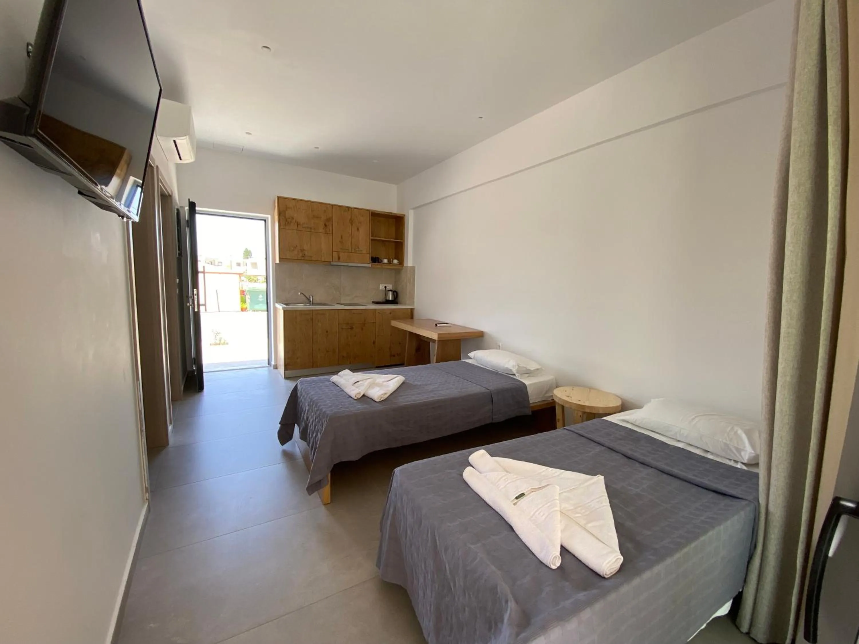 Living room, Bed in Blue Aegean Hotel & Suites