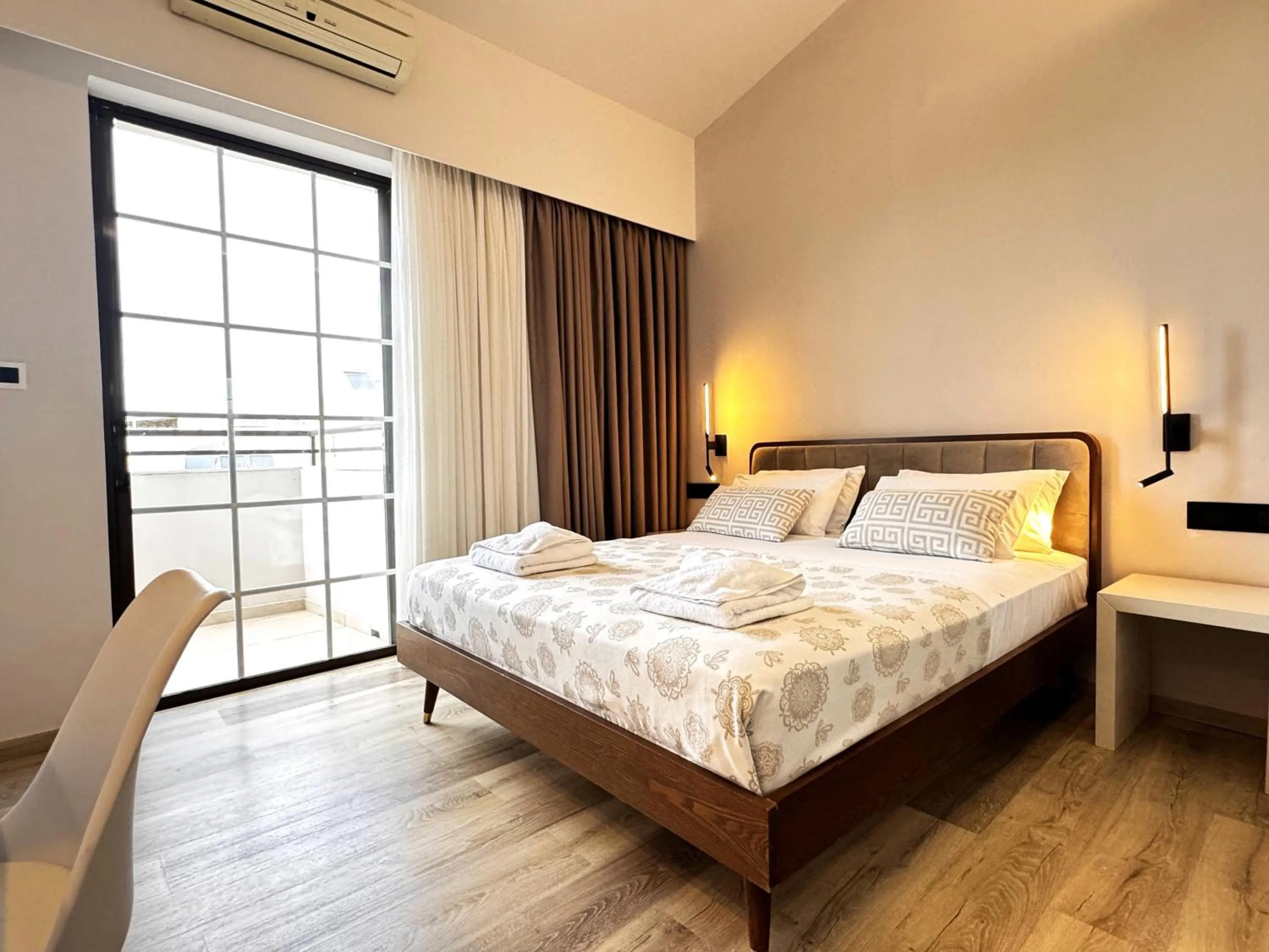 Bed in Elina Hotel Apartments