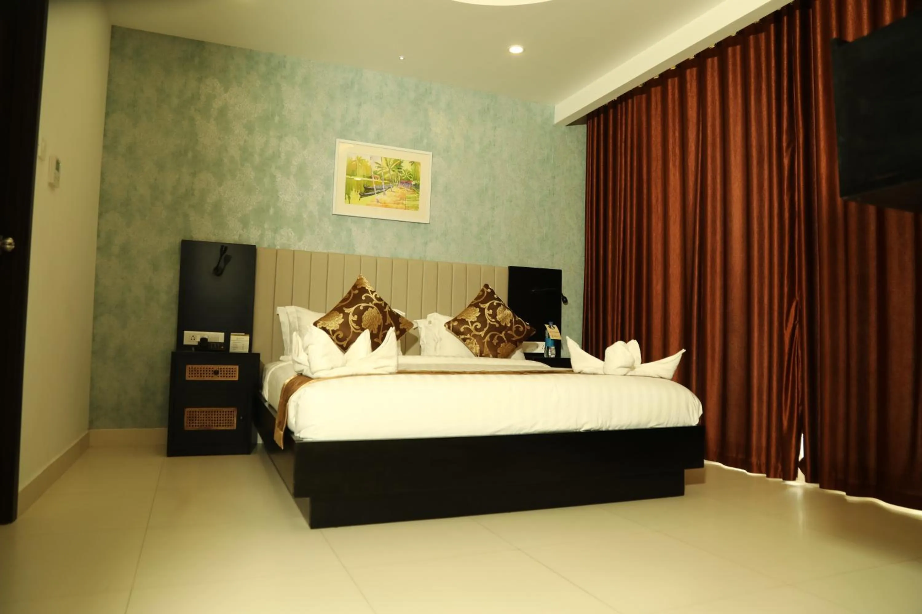 Bed in MARIYALAYAM MUNROE ISLAND RESIDENCY