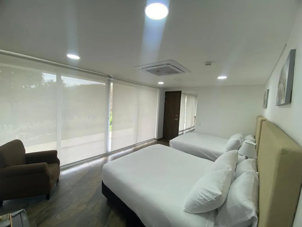 Seating area, Bed in Hotel Explore Caño Dulce