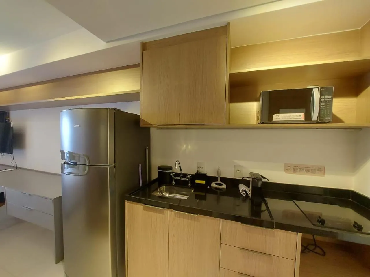 Kitchen or kitchenette in Lindo studio em Moema