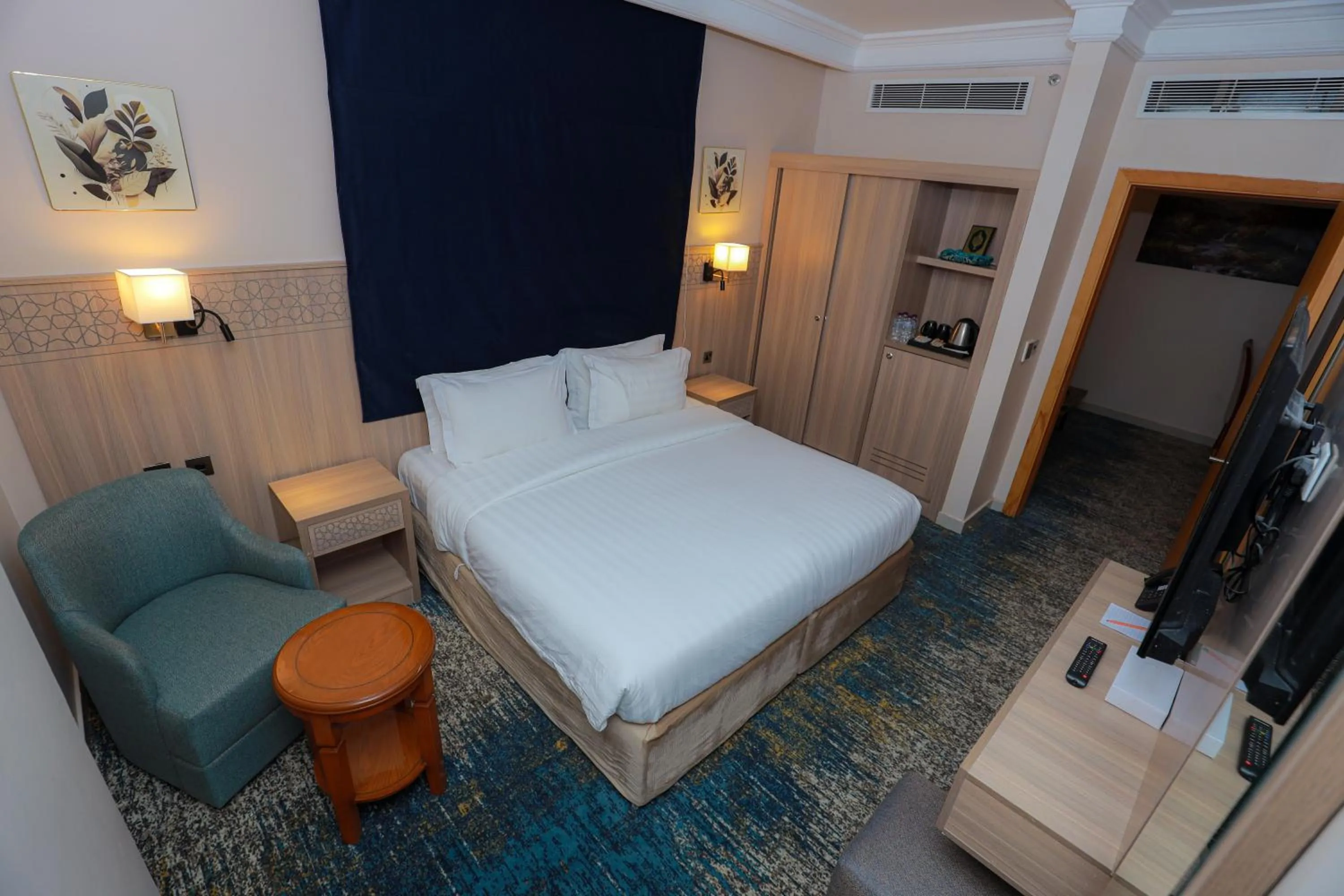 Bed in Nawazi Towers Hotel