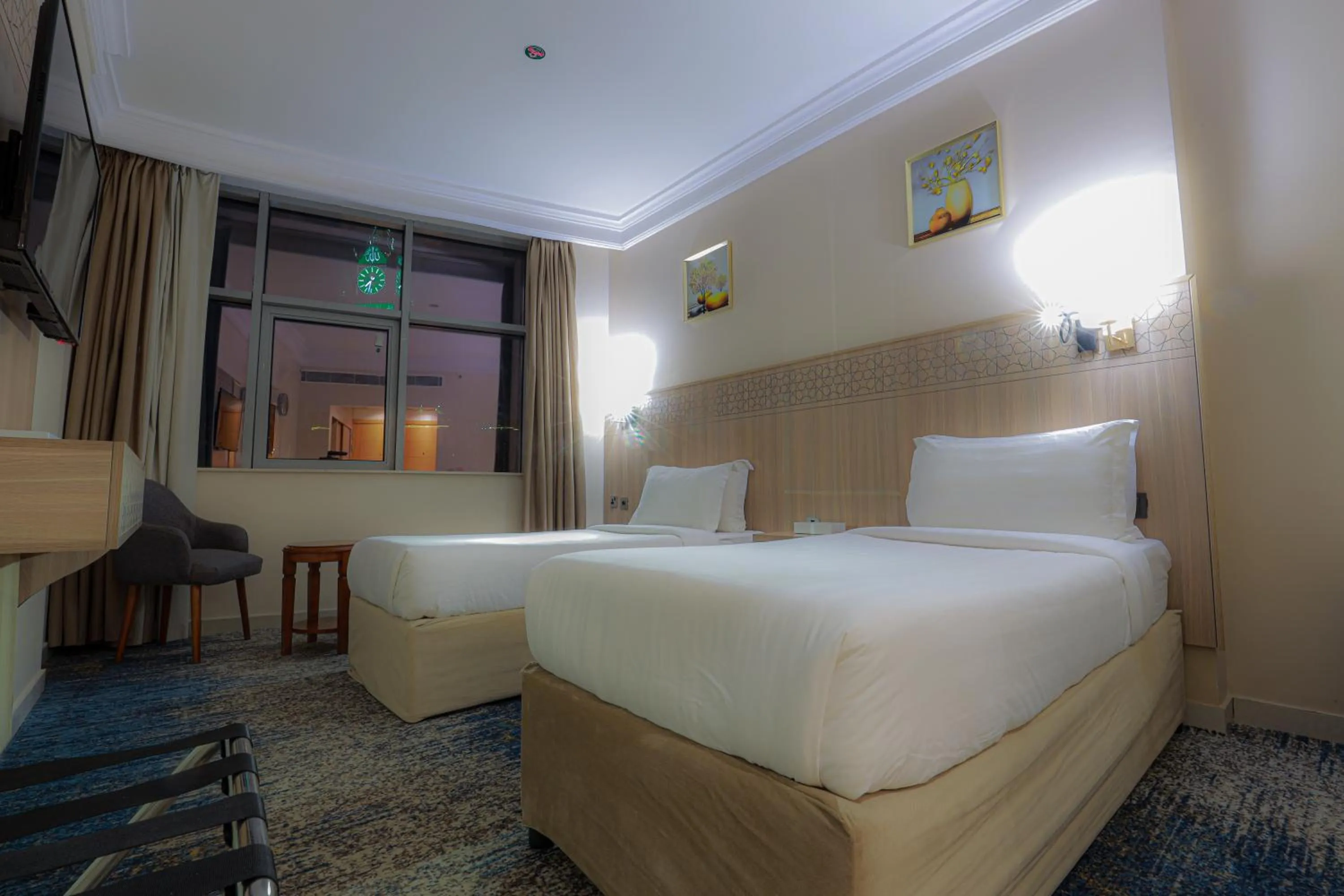 Bed in Nawazi Towers Hotel