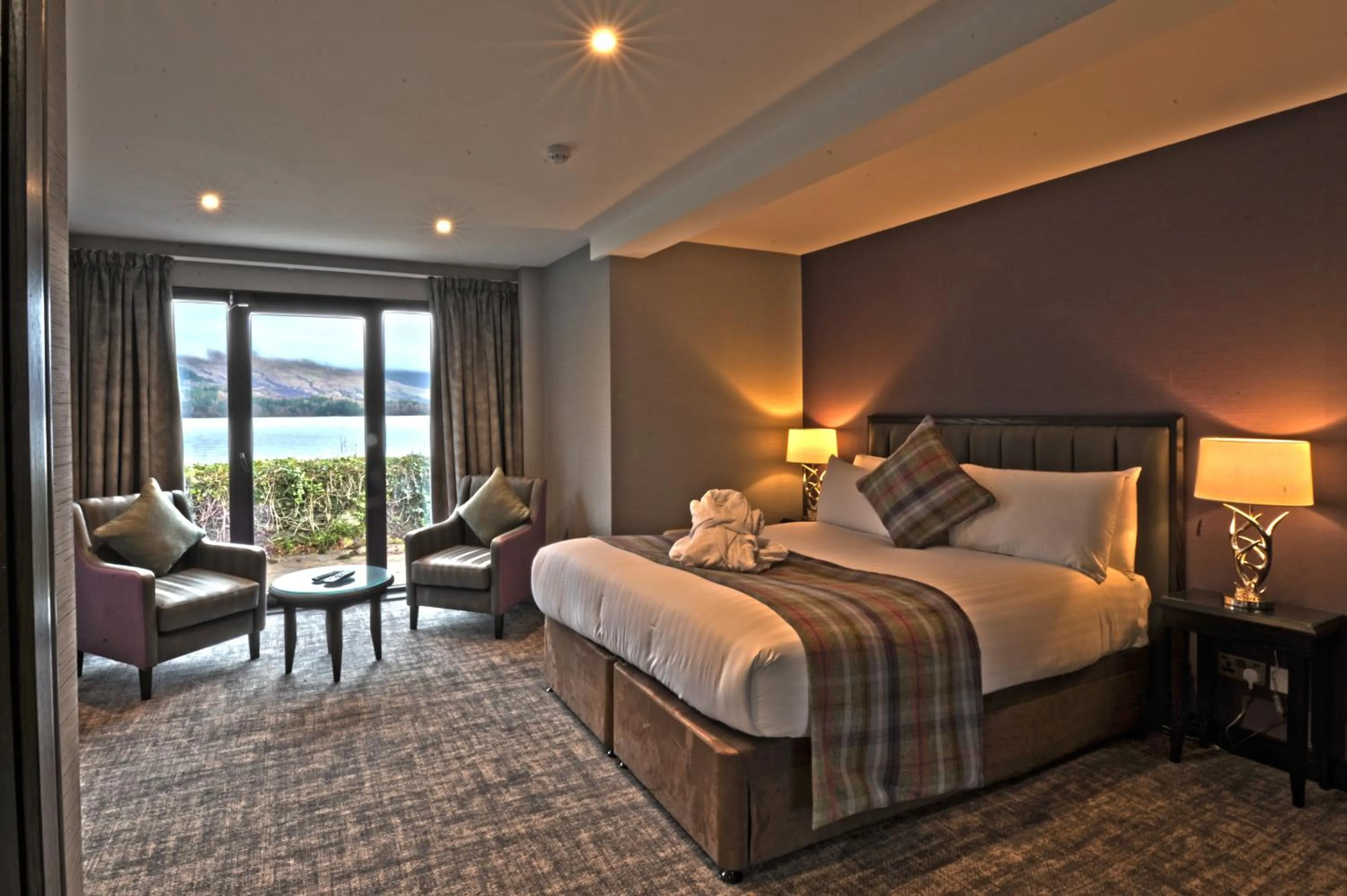 Seating area, Bed in The Beach House Loch Lomond