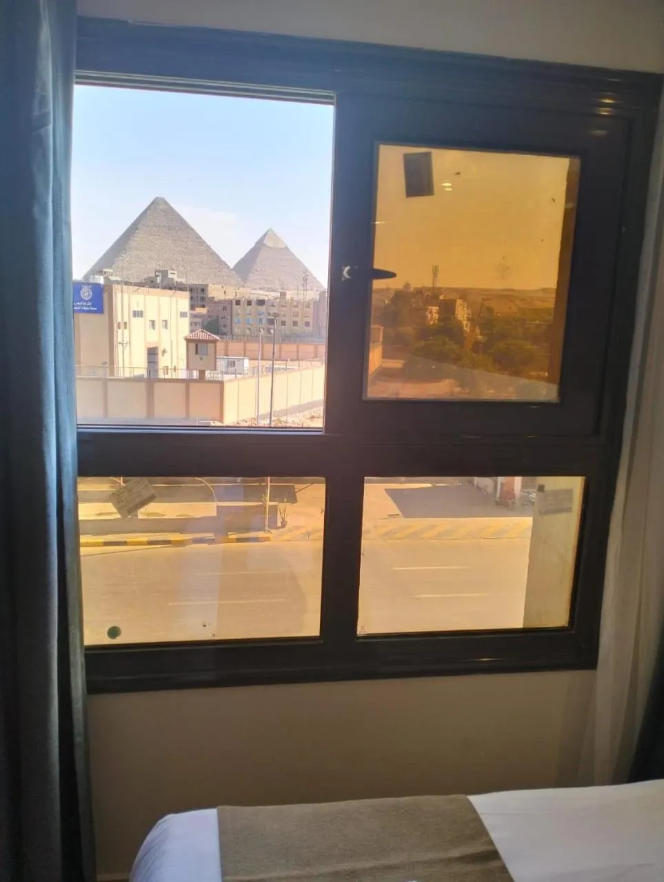 View (from property/room), Bed in Pyramid Front Hotel