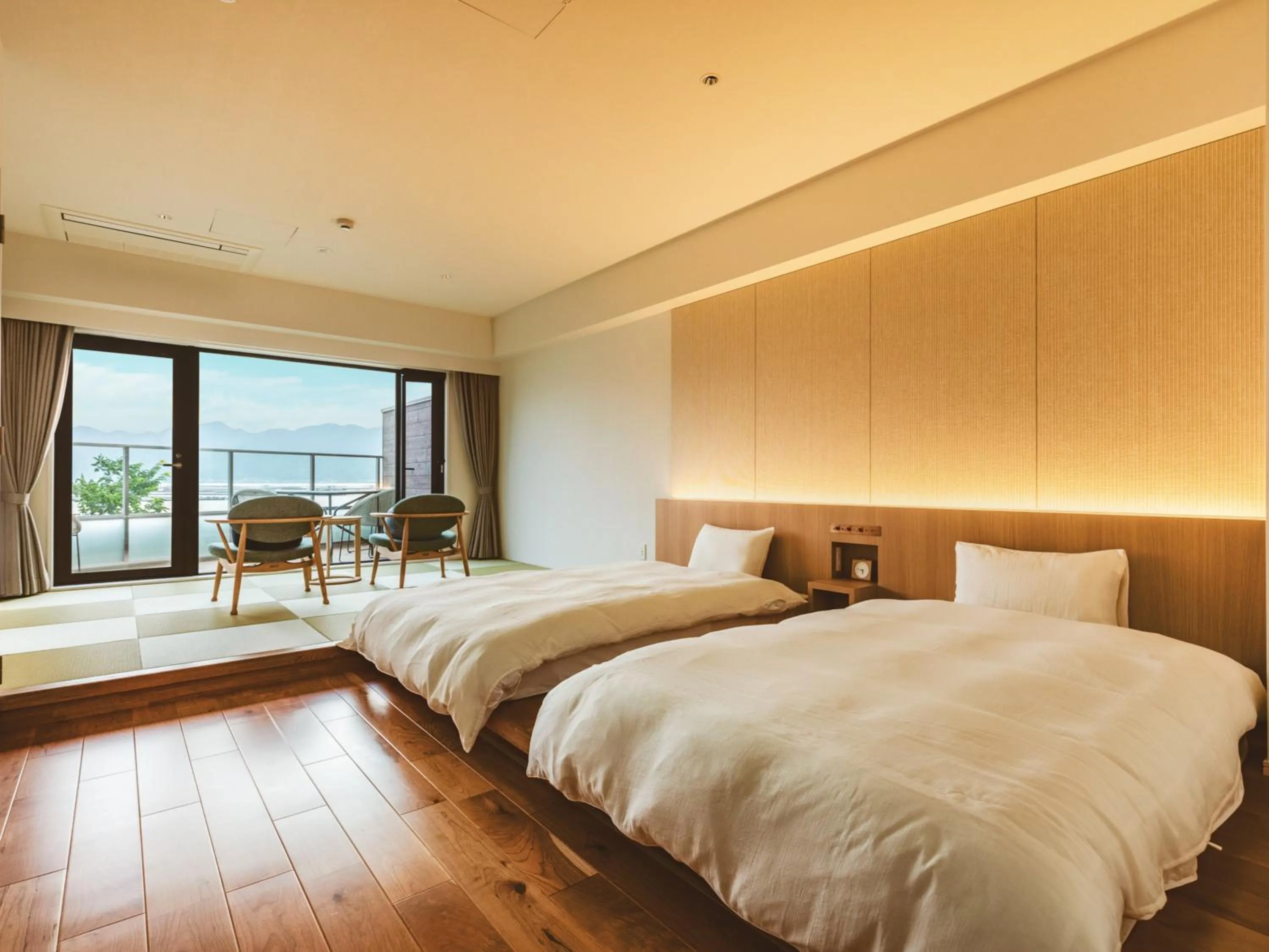 Photo of the whole room, Bed in Etajimasou Hotel & SPA Hiroshima