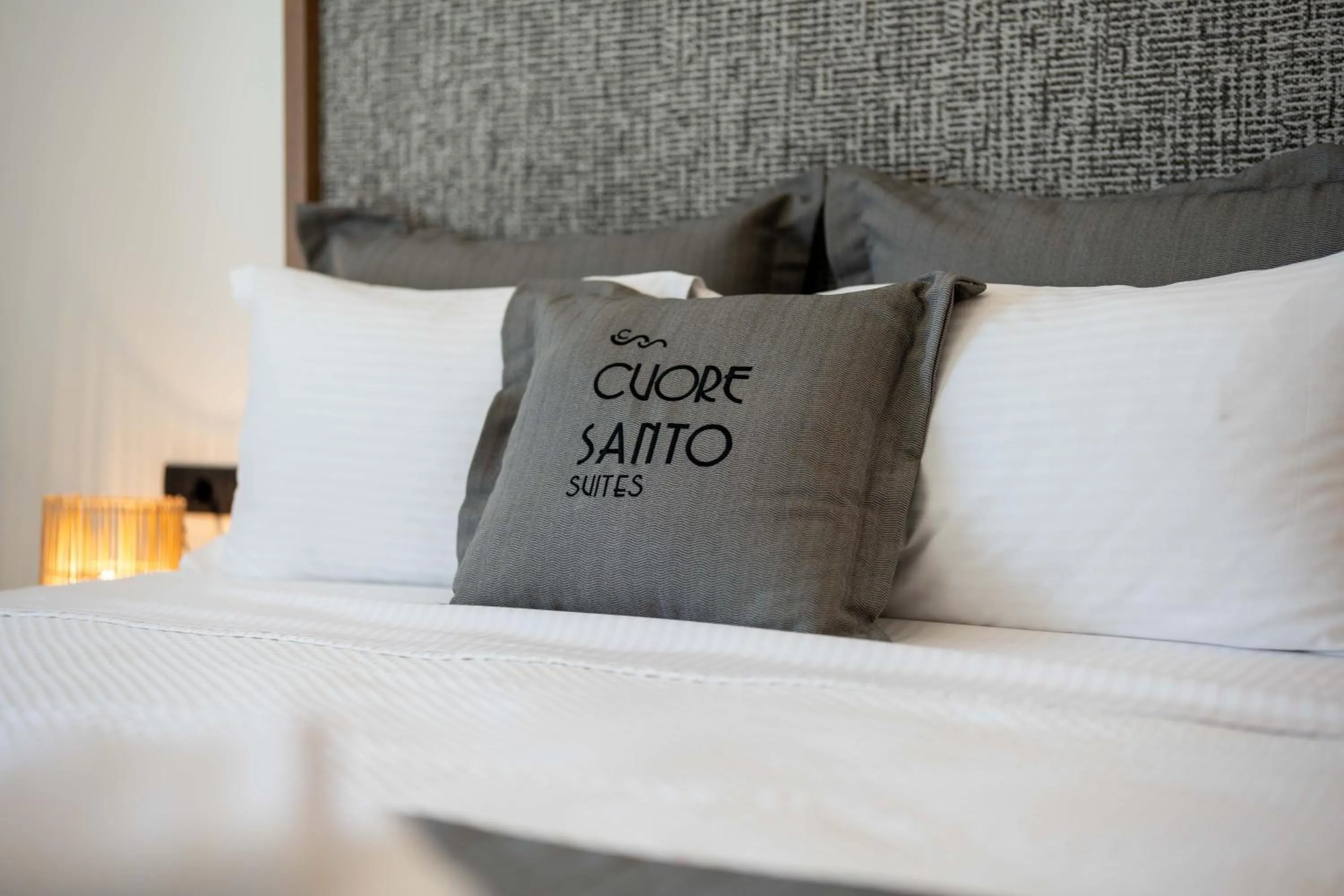 Bed in Cuore Santo Suites