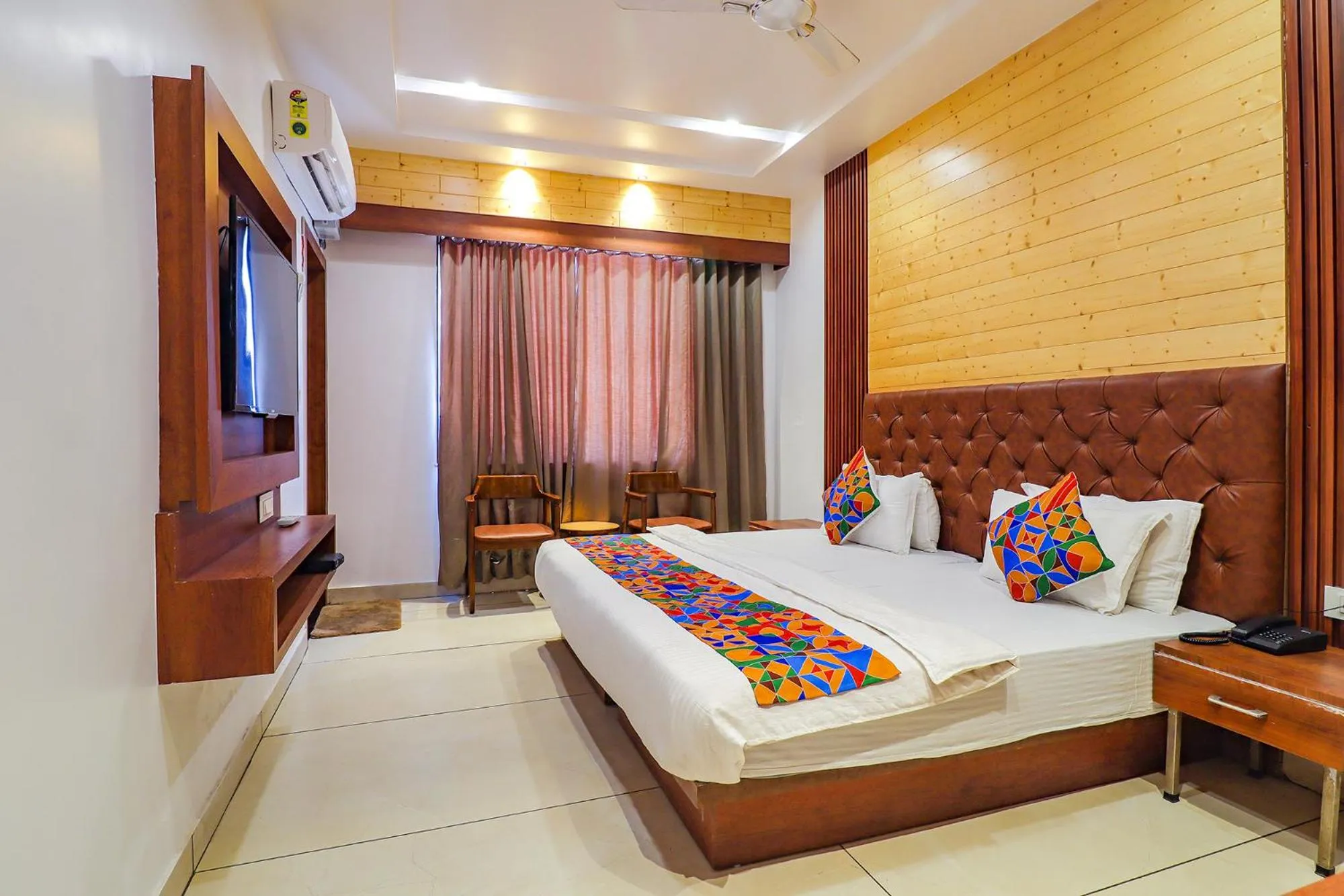 Bed in FabHotel Grand Arya