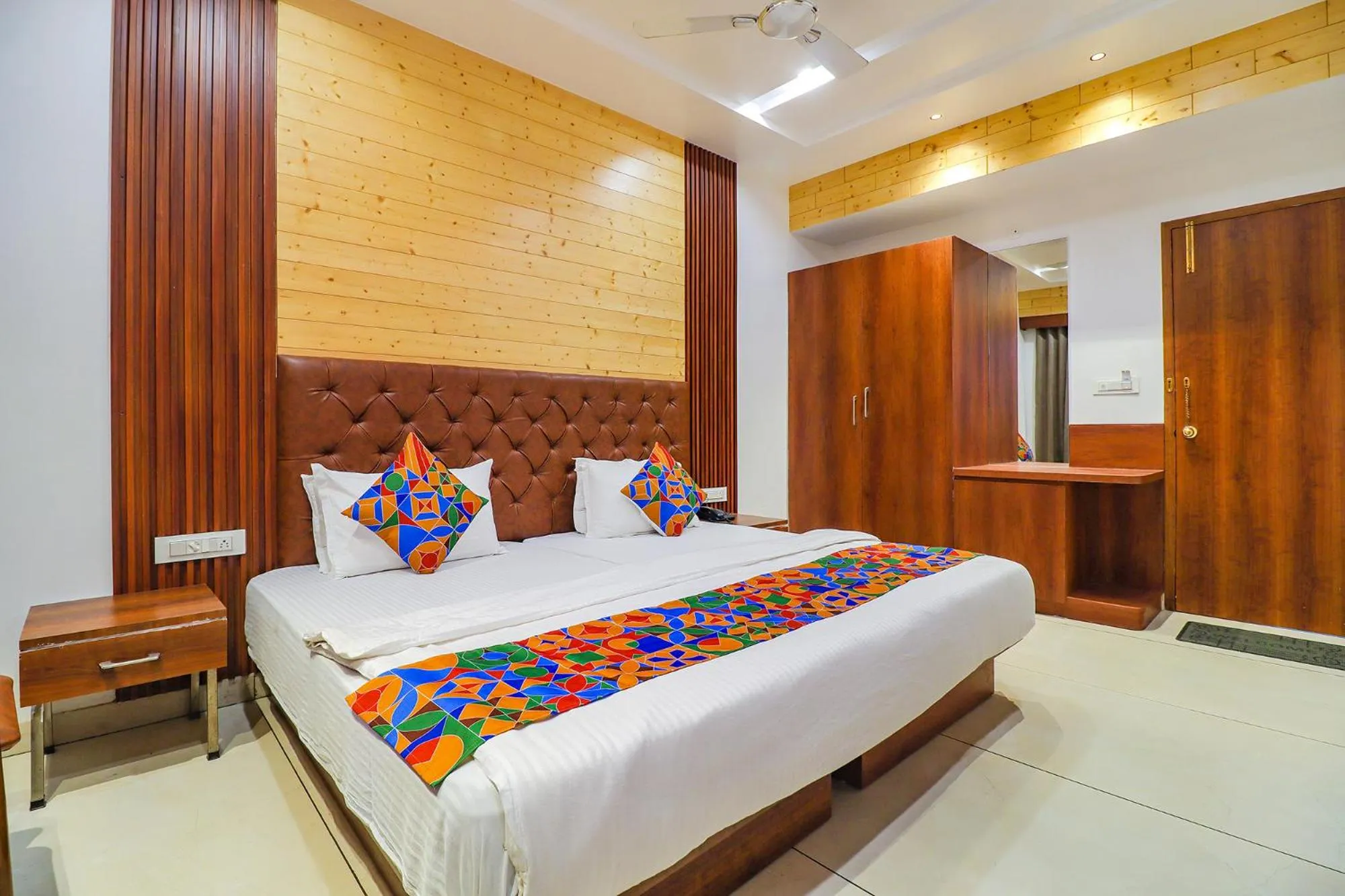 Bed in FabHotel Grand Arya