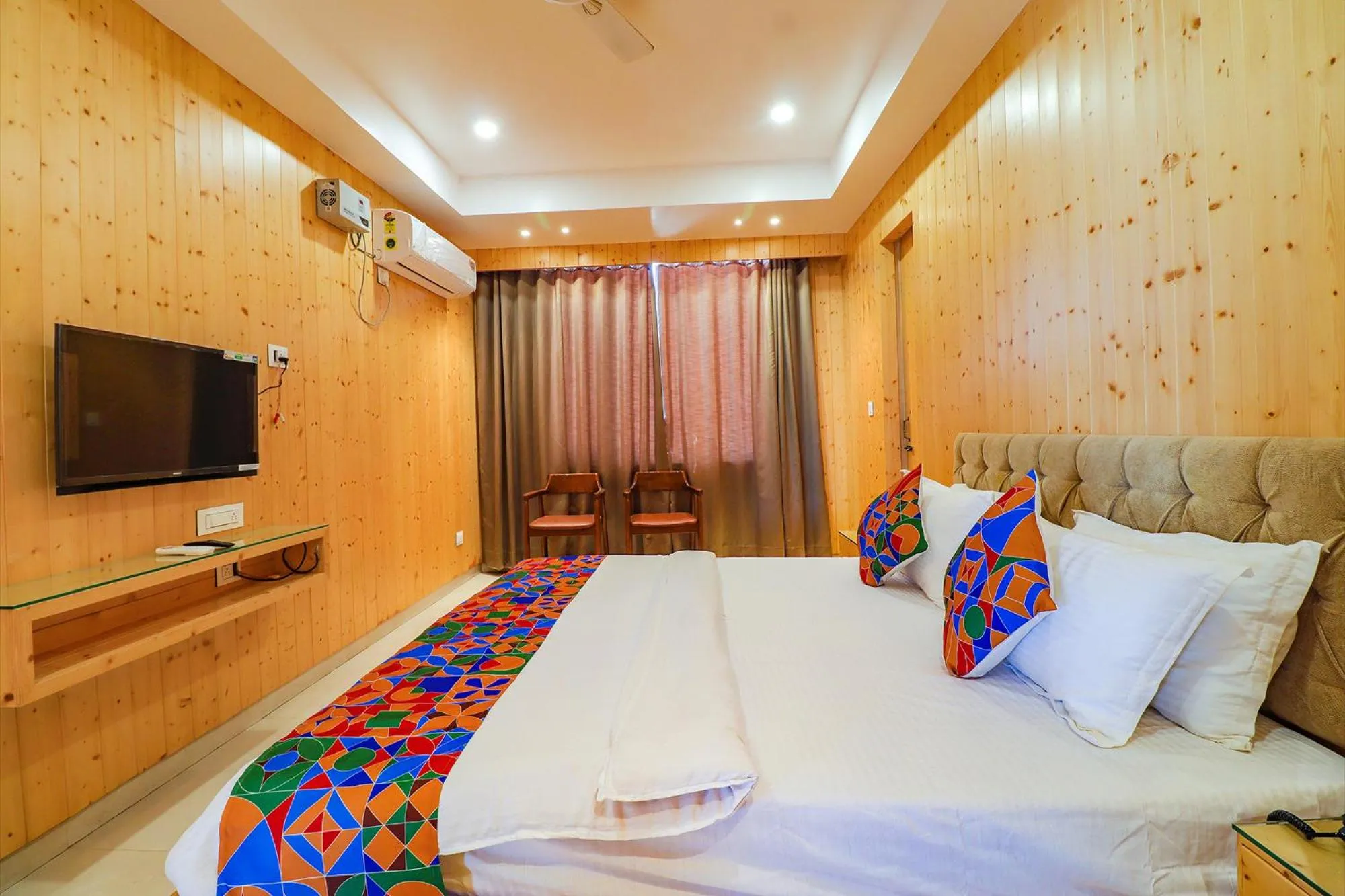 Bed in FabHotel Grand Arya