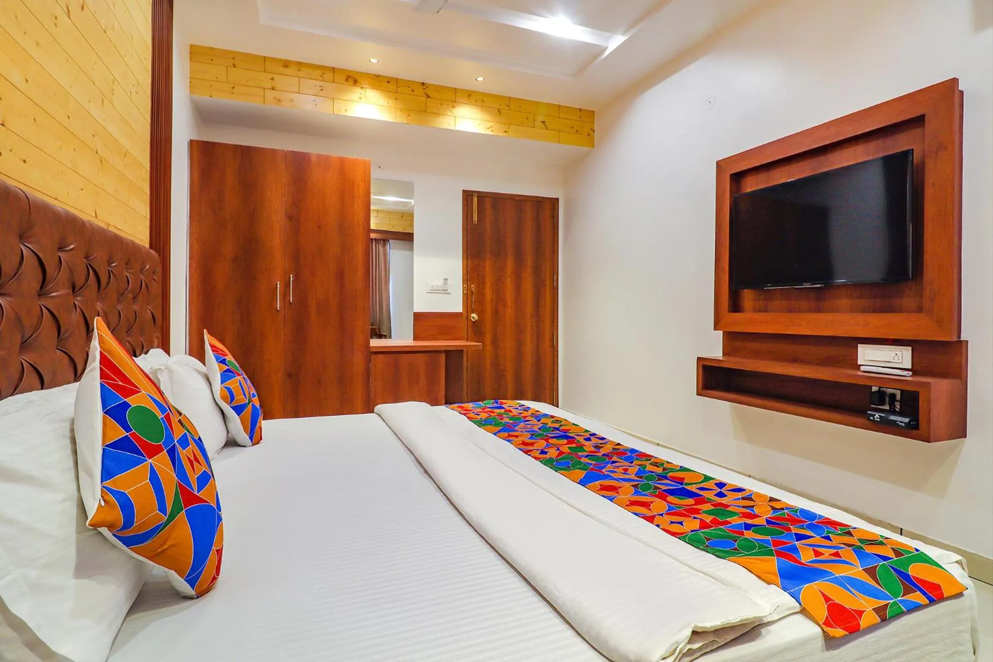 Bed in FabHotel Grand Arya