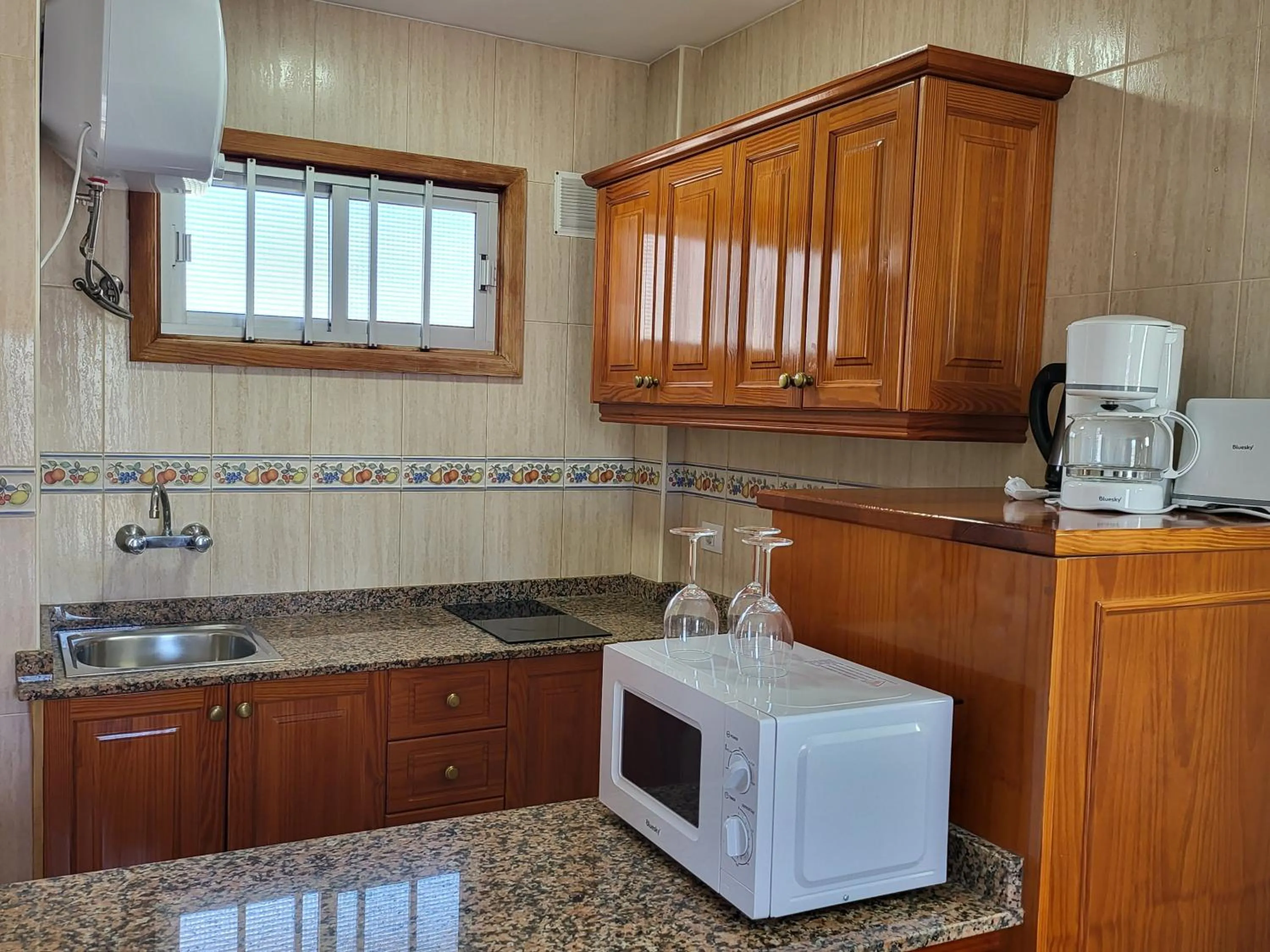 Kitchen or kitchenette in Las Camelias Apartments