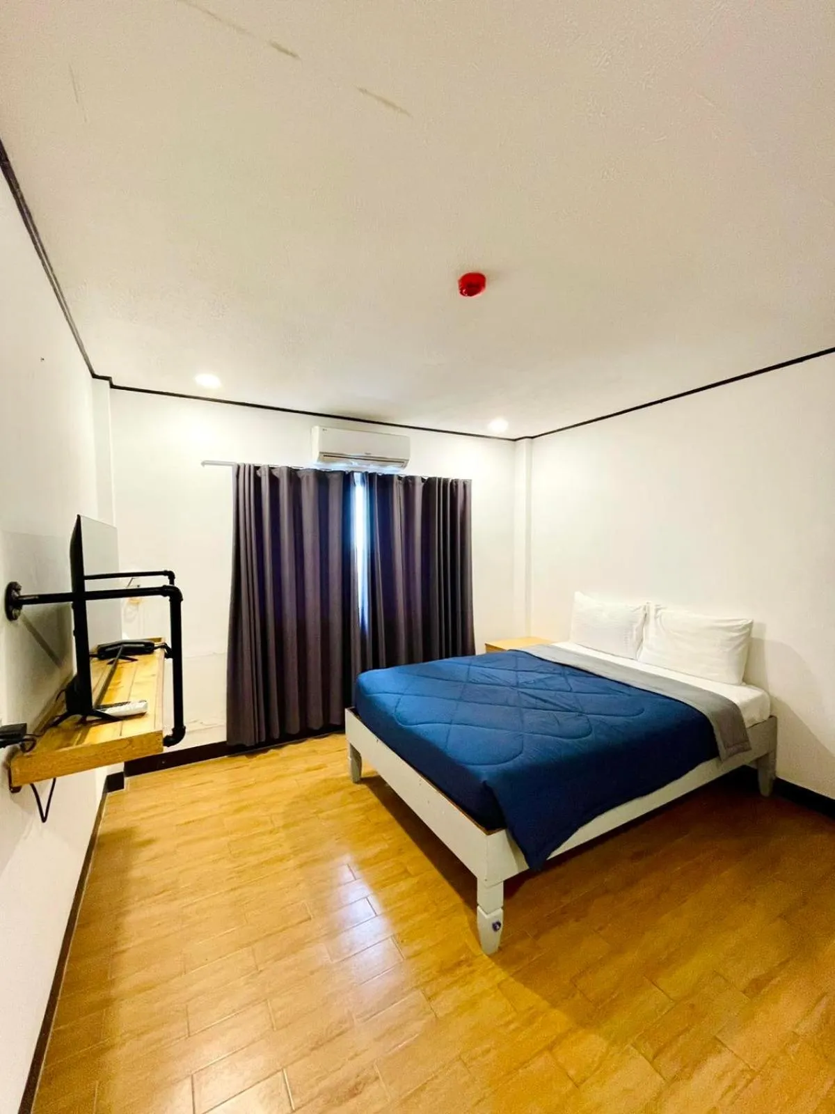 Bed in Bluewing Hotel Angeles powered by Cocotel