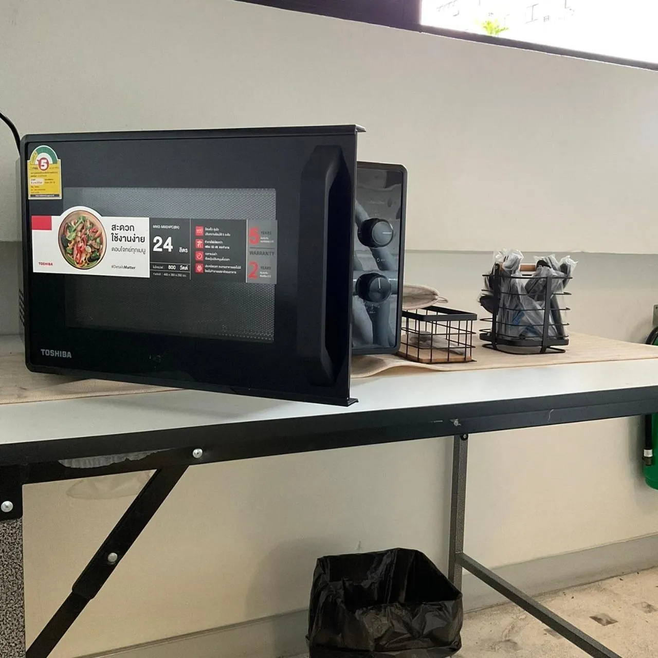 Communal kitchen in Suksomboon Residence