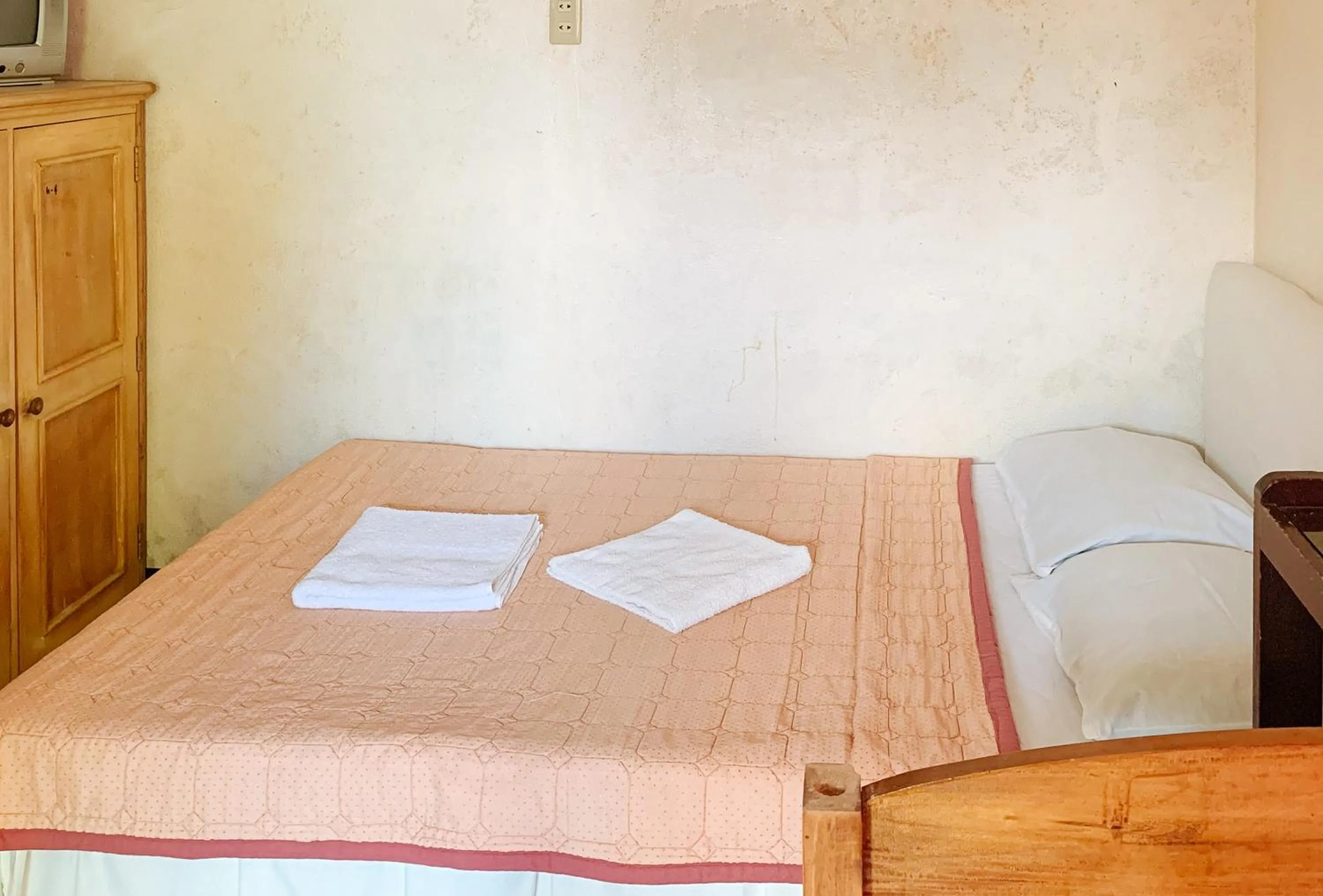 Toilet, Bed in Carmen Veranda Resort