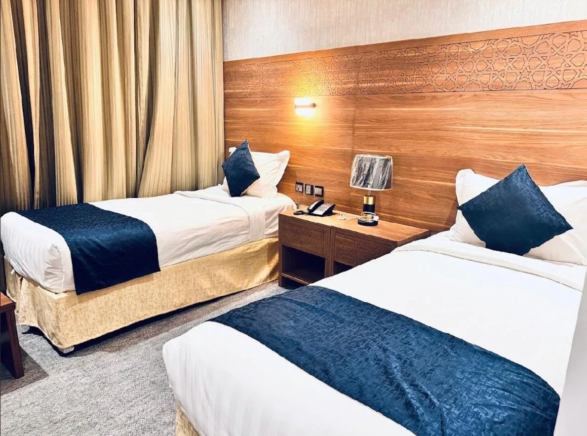 Bed in Rowaa Al Azizia Hotel