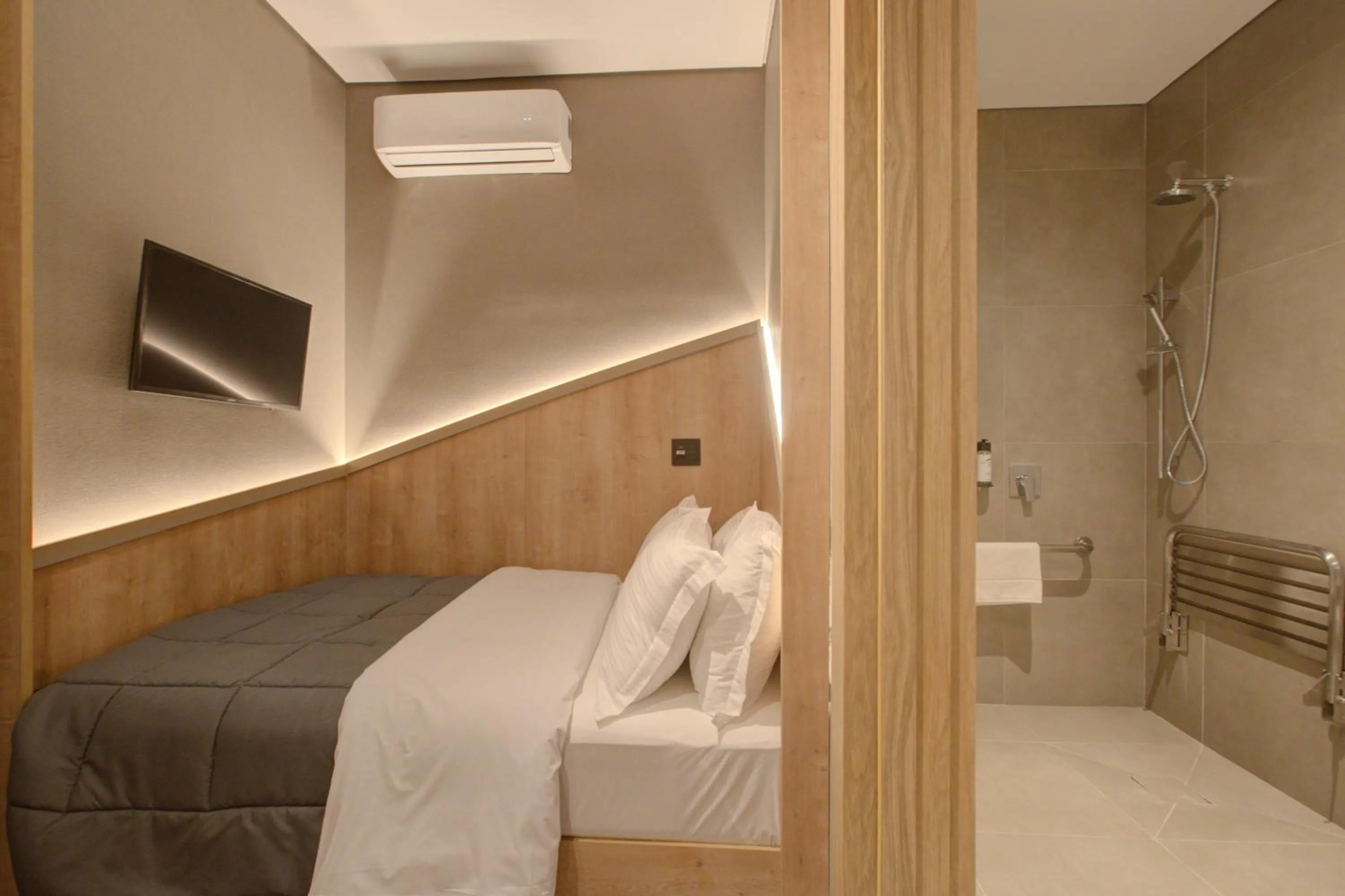Bed in Fast Sleep Suites by Slaviero Hoteis - Hotel dentro do Aeroporto de Guarulhos - Terminal 2 - desembarque oeste