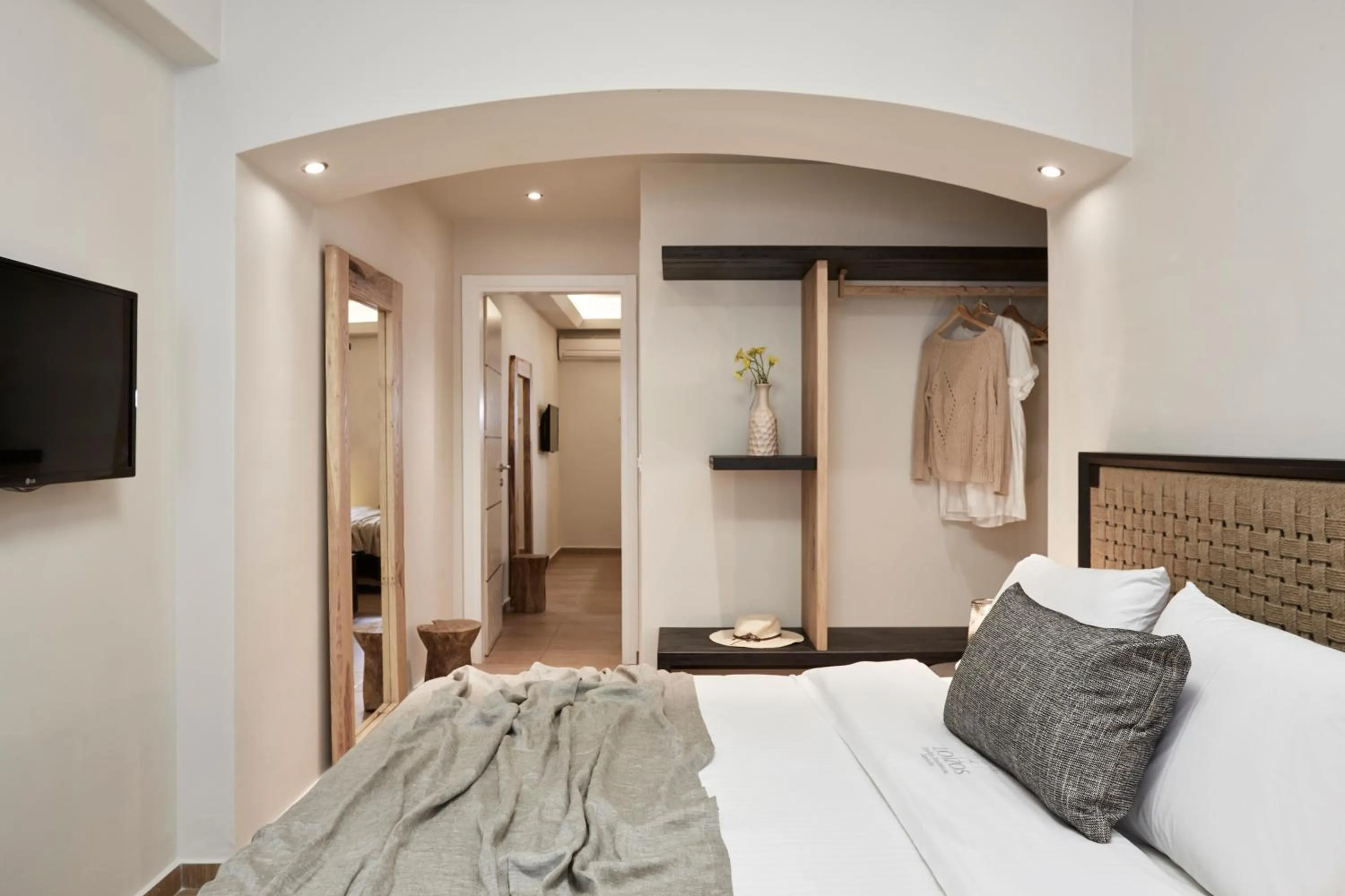 Bed in Loizos Stylish Residences