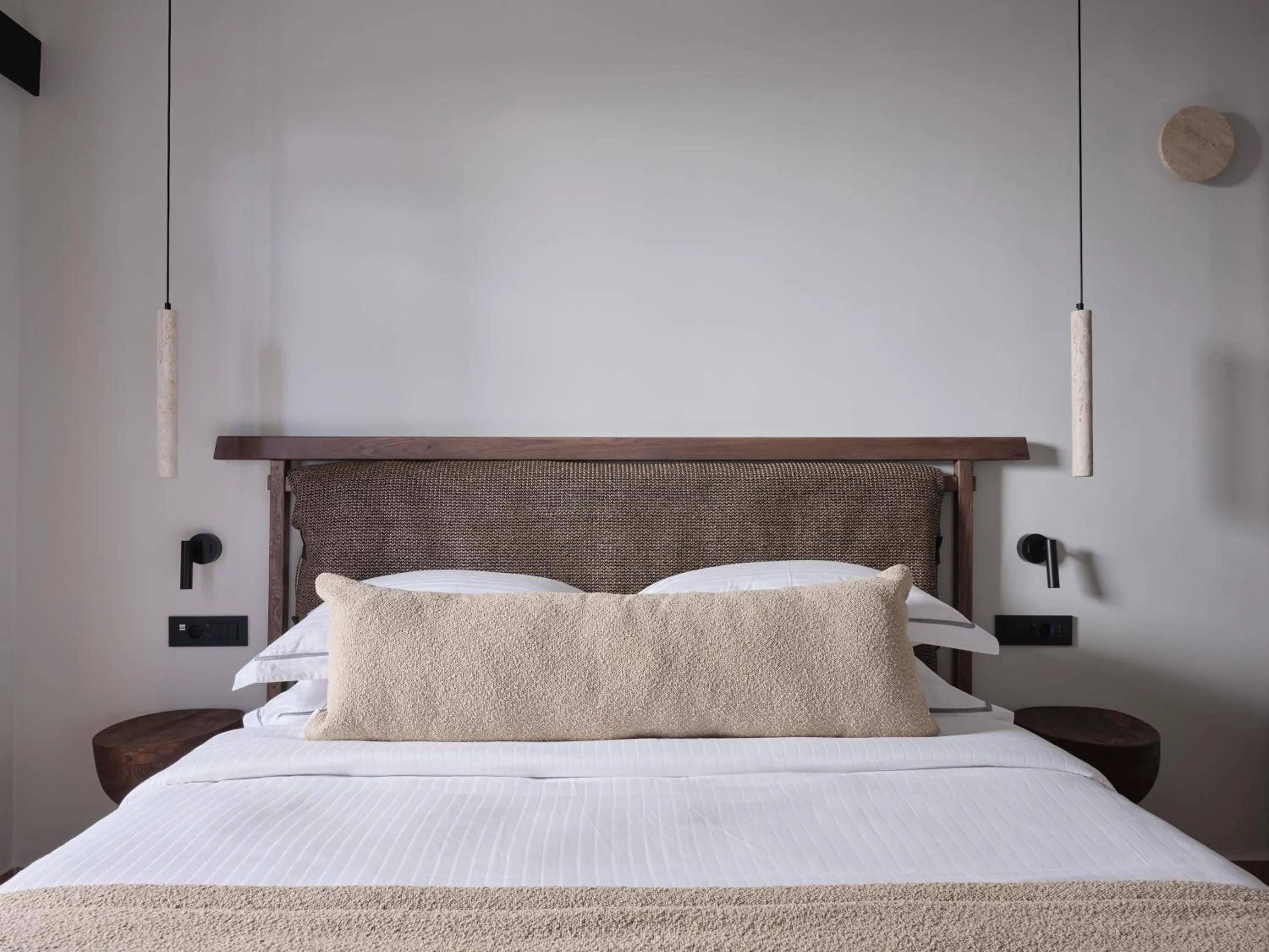 Bed in Loizos Stylish Residences