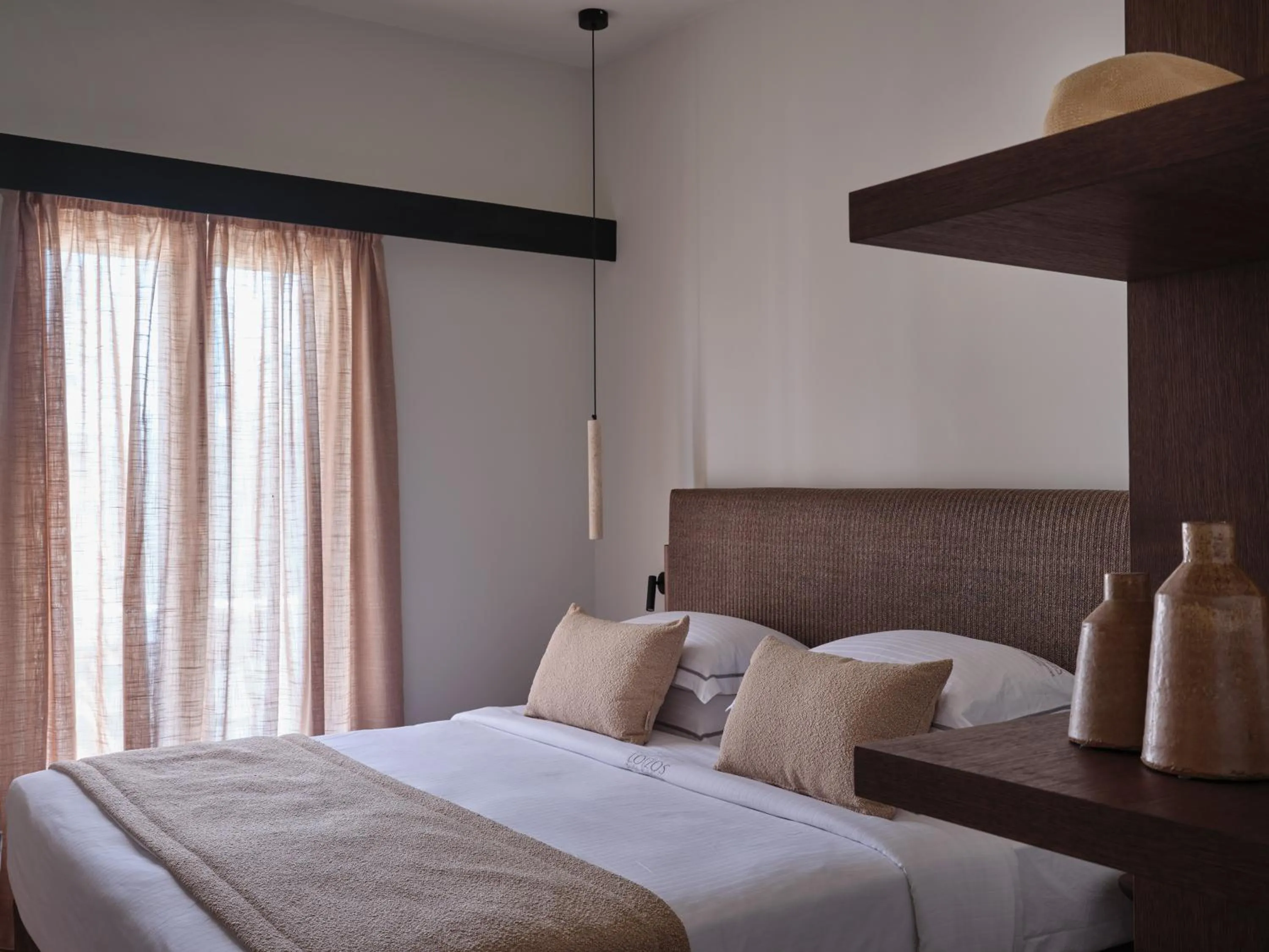 Bed in Loizos Stylish Residences