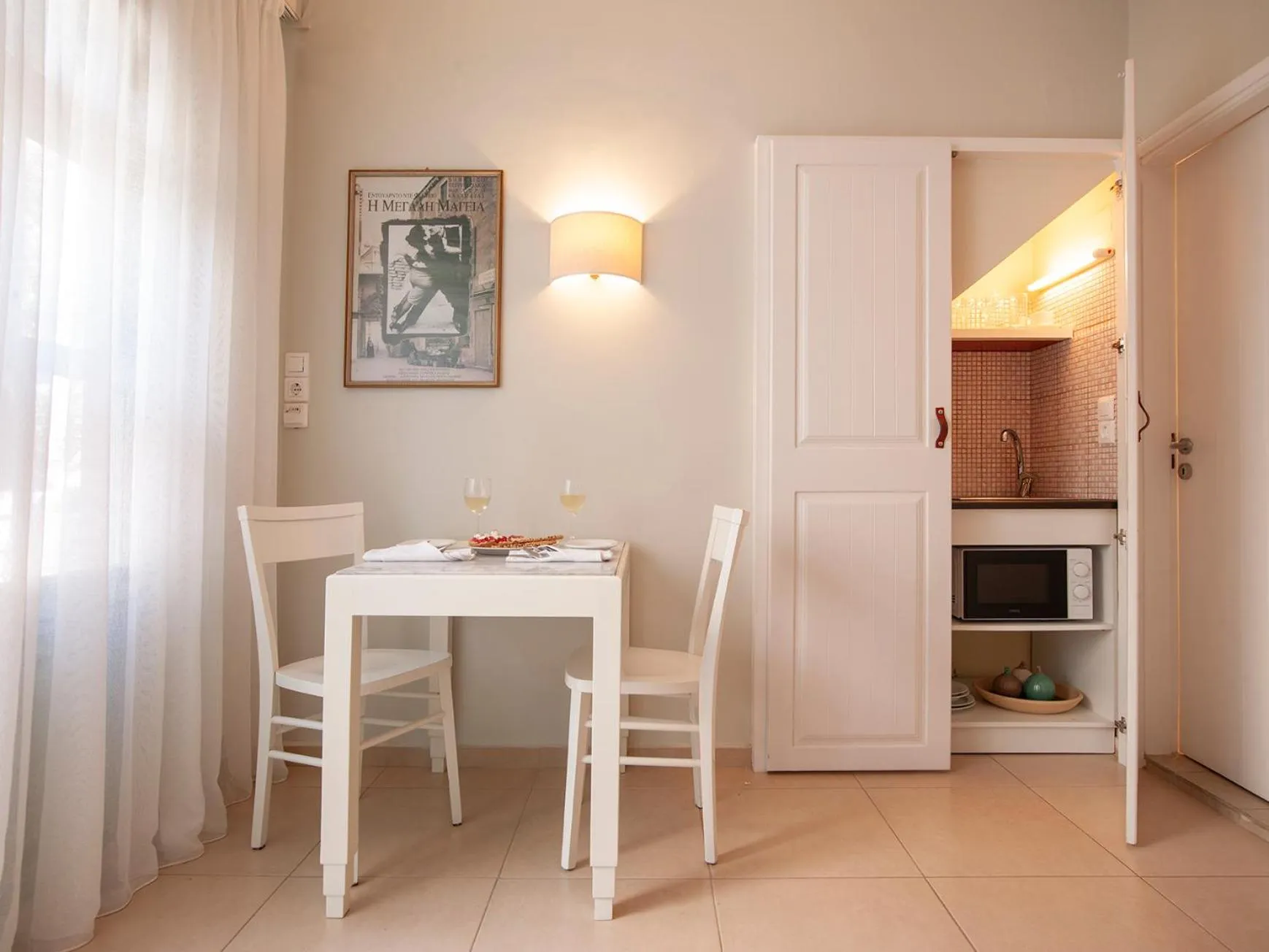 Kitchen or kitchenette in Mythos Suites Boutique Hotel