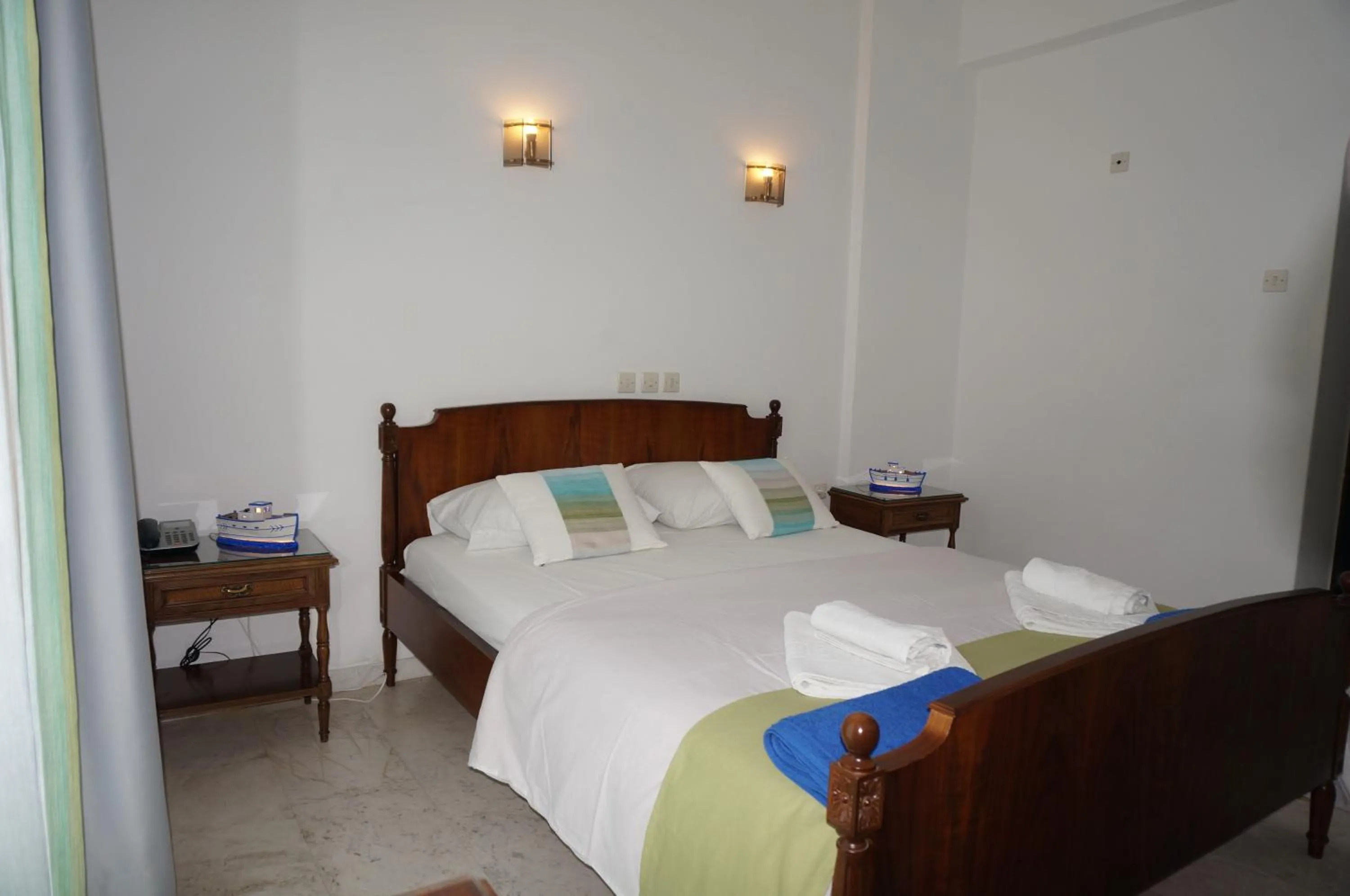 Bed in Adonis Hotel Naxos