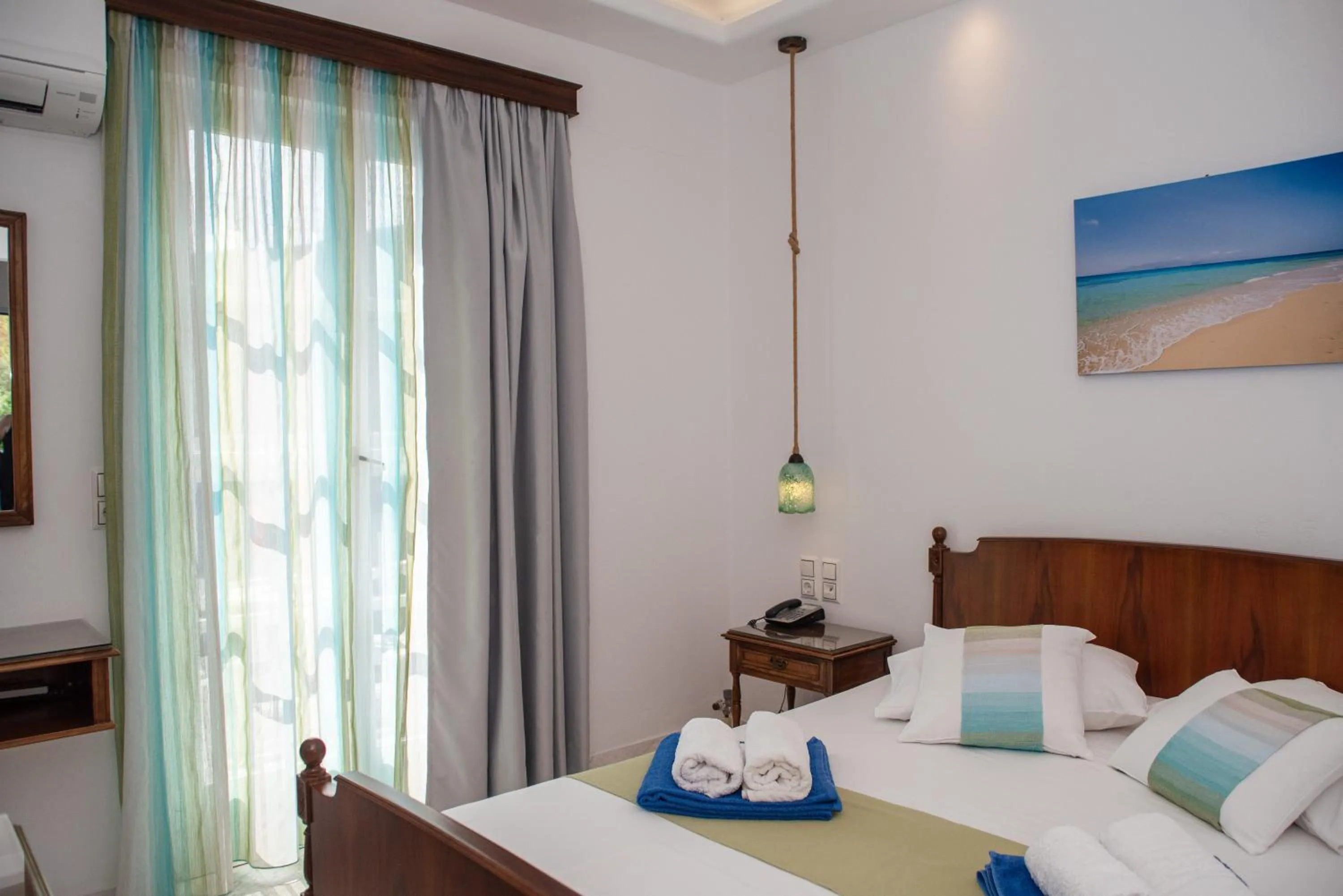 Bed in Adonis Hotel Naxos
