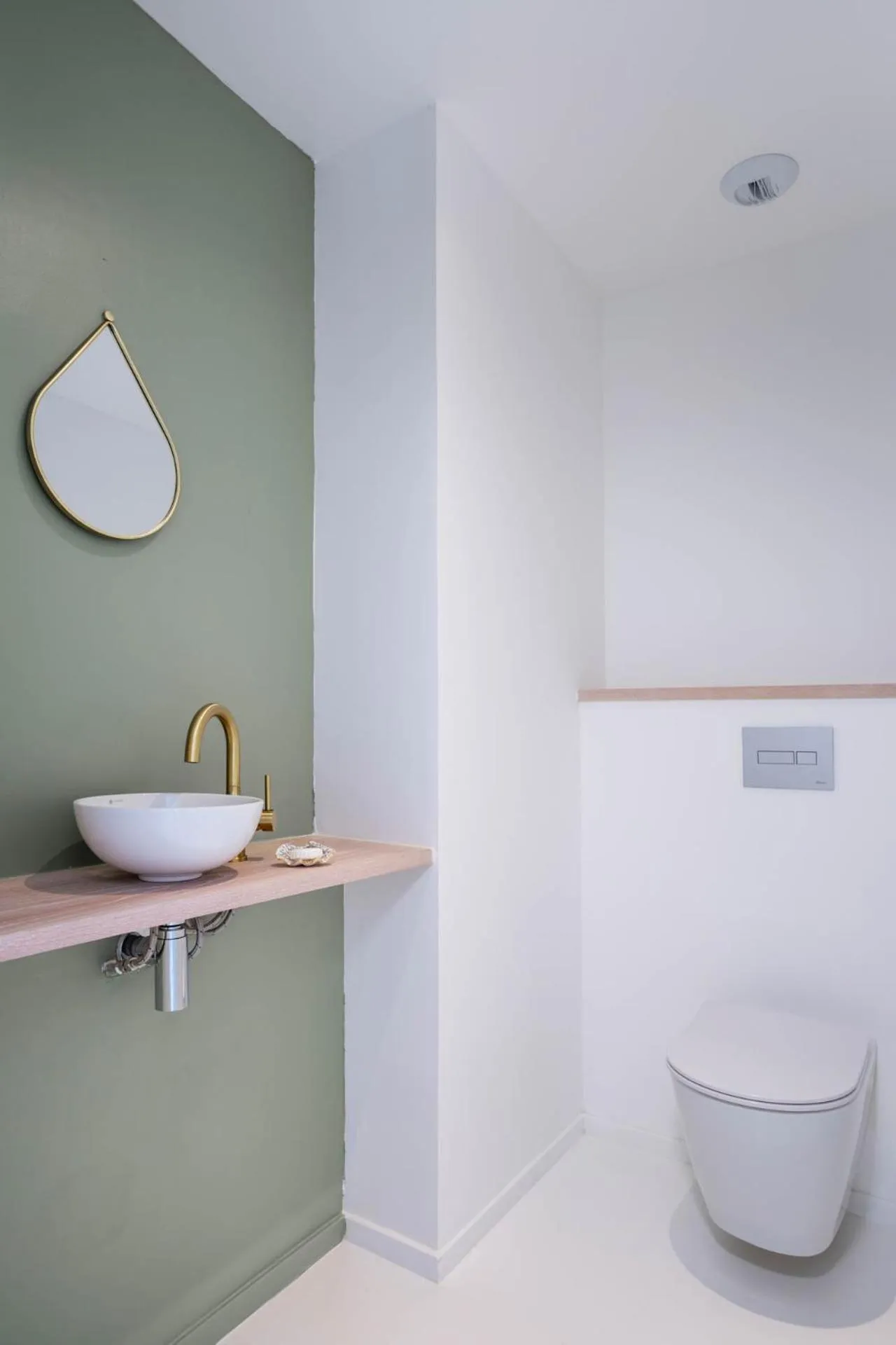 Toilet in Cook's Bay Hotel & Suites