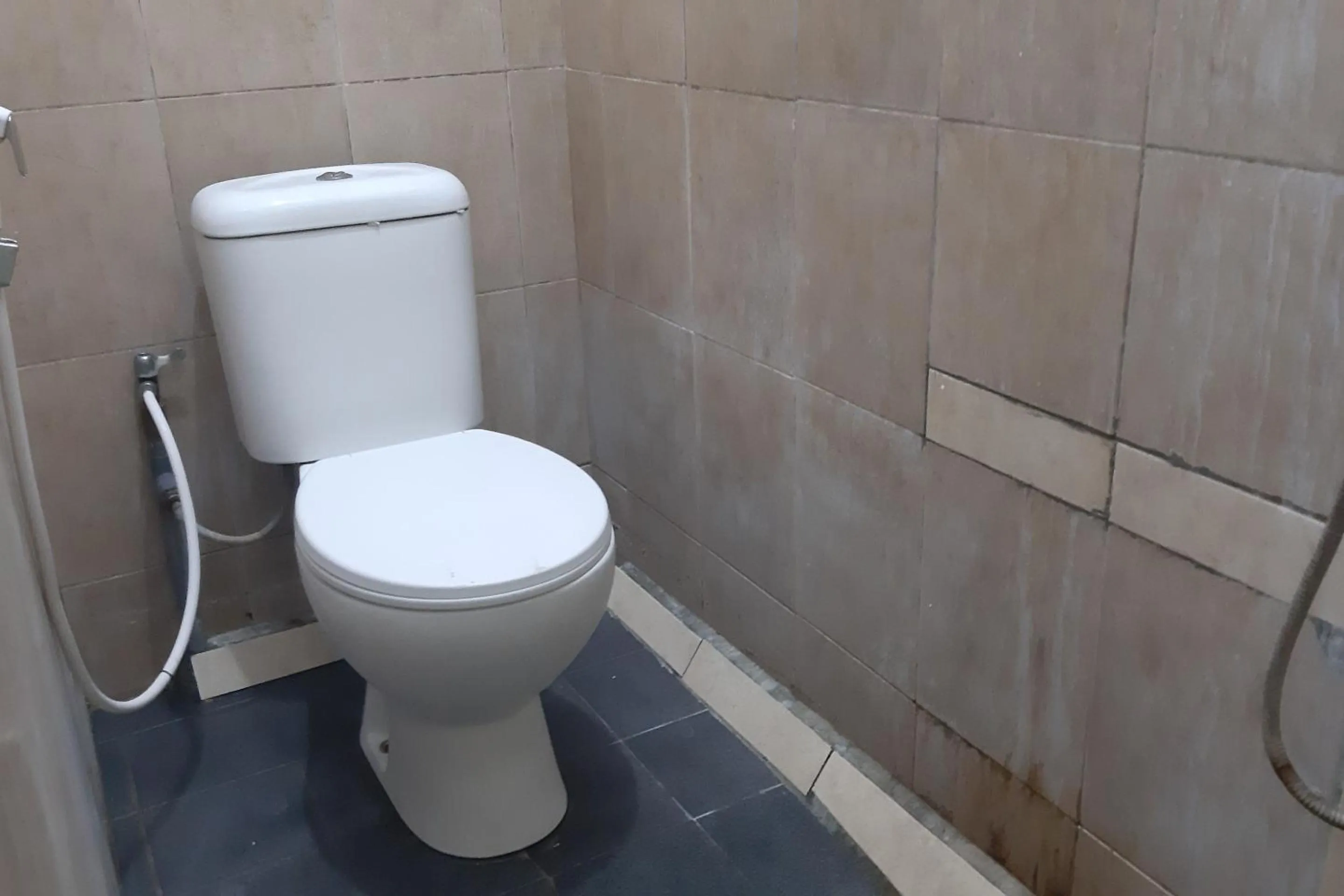 Bathroom in Hotel O Fanilly Guest House MarabahanNearJembatan Rumpiang