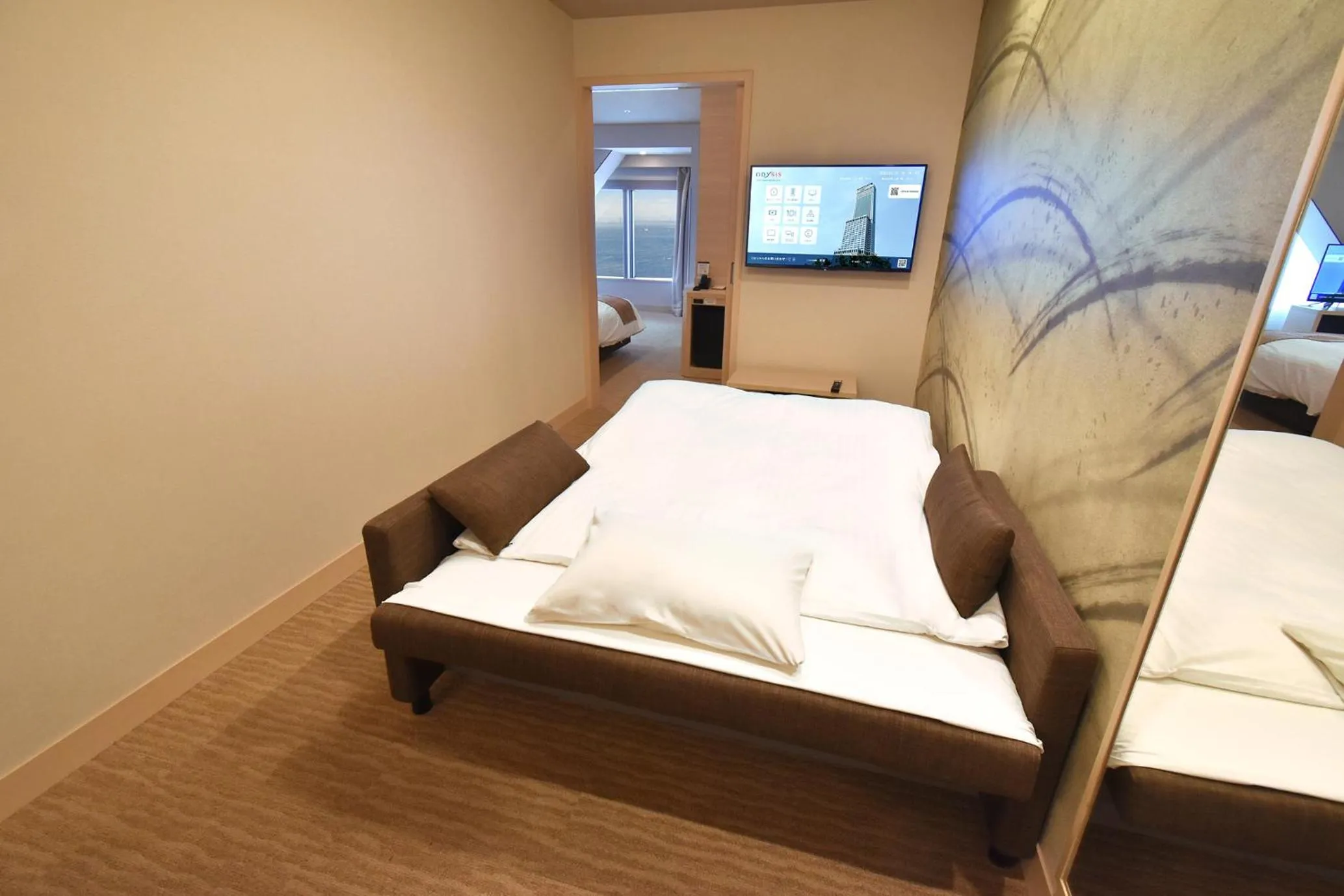 Photo of the whole room, Bed in Odysis Suites Osaka Airport Hotel
