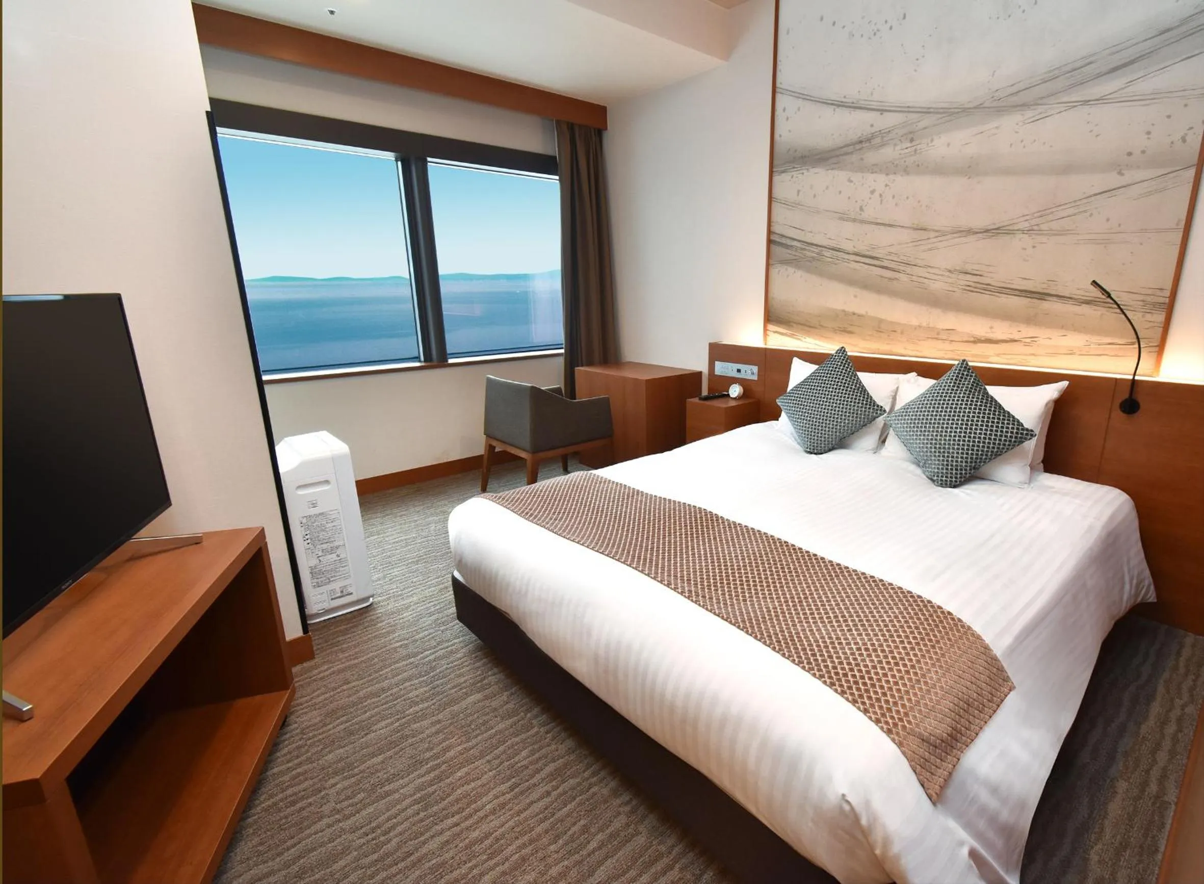 Photo of the whole room, Bed in Odysis Suites Osaka Airport Hotel