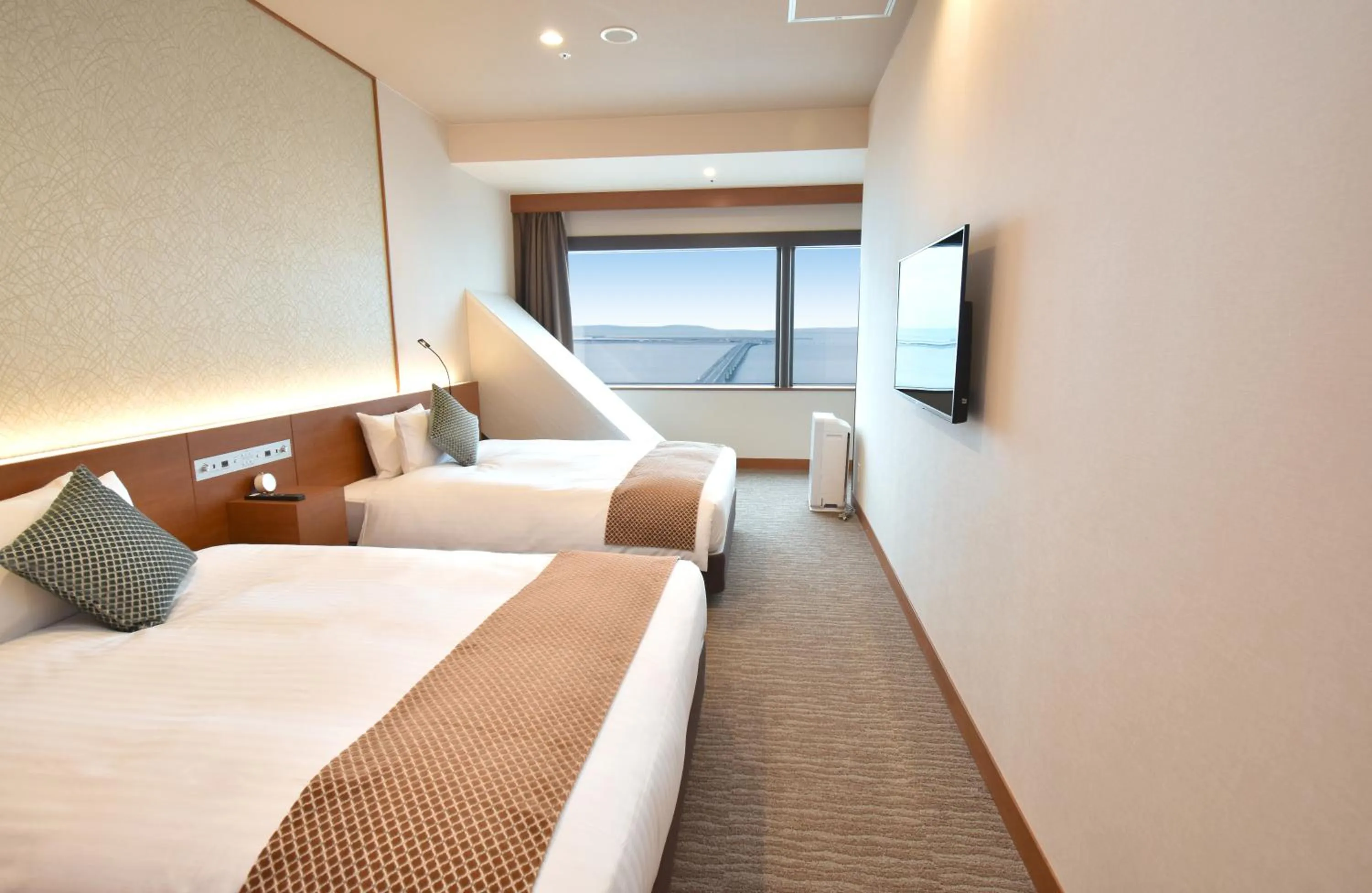 Photo of the whole room, Bed in Odysis Suites Osaka Airport Hotel