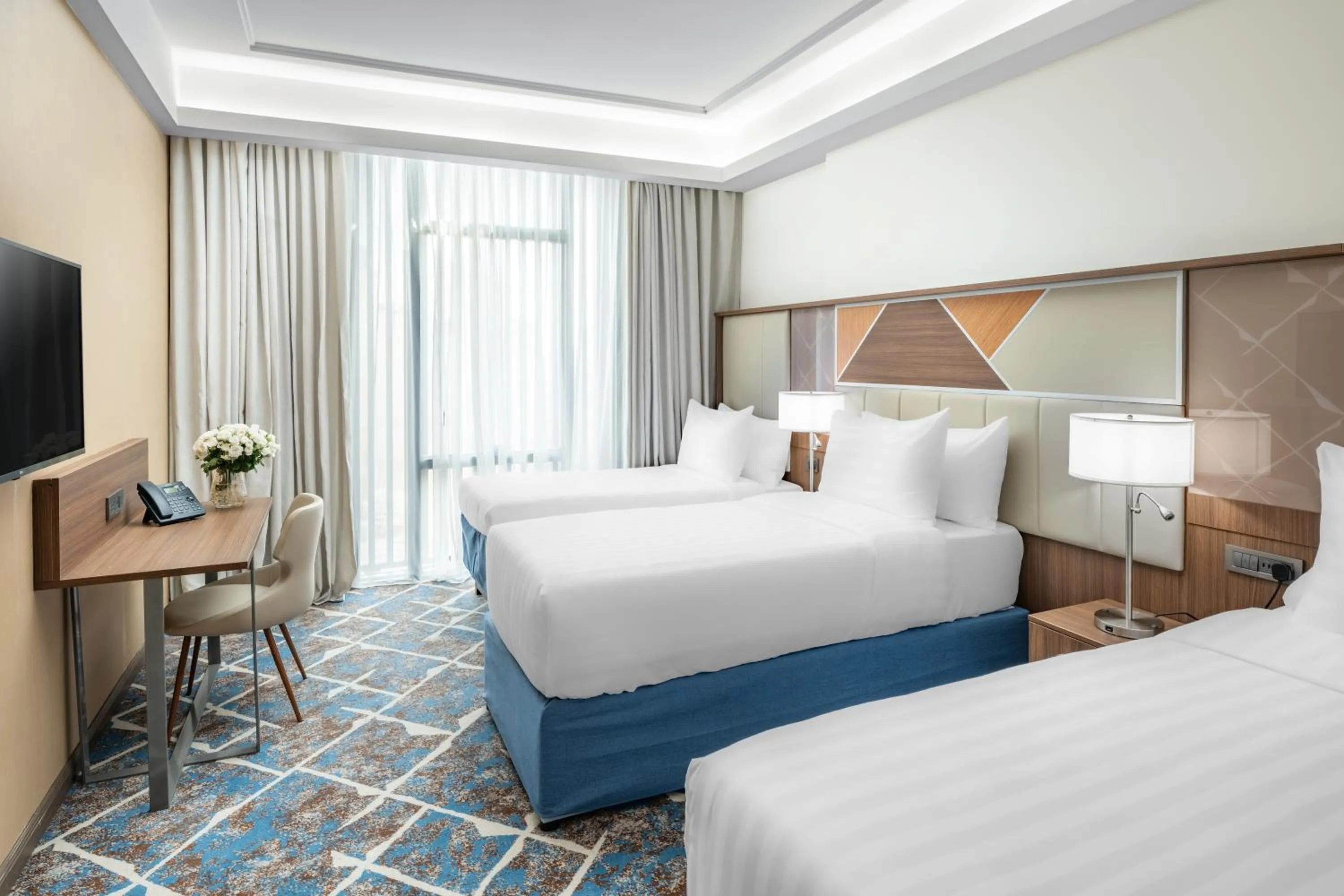 Bed in Three Pearls Musalli Hotel