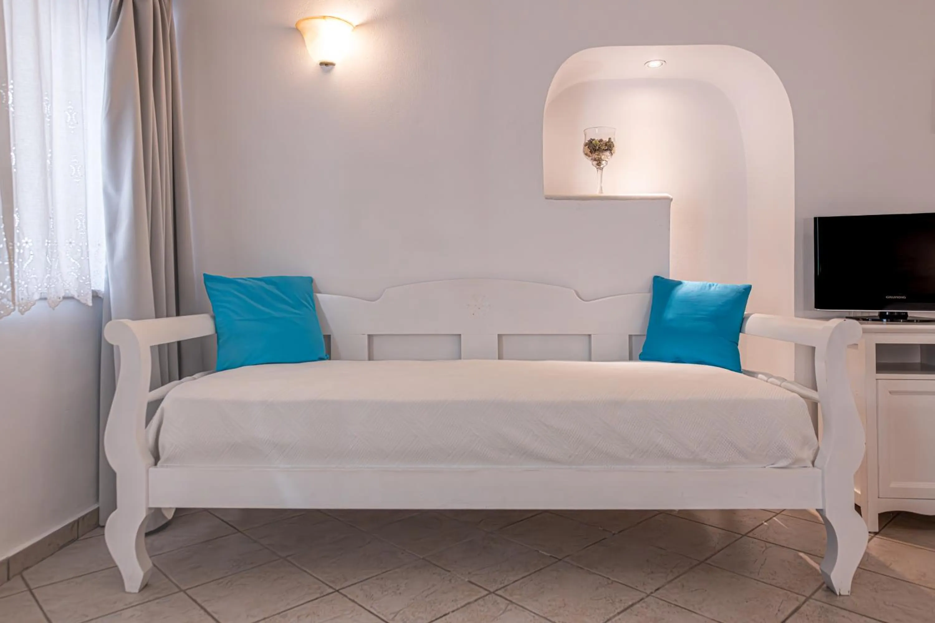 Bed in Reverie Santorini Hotel