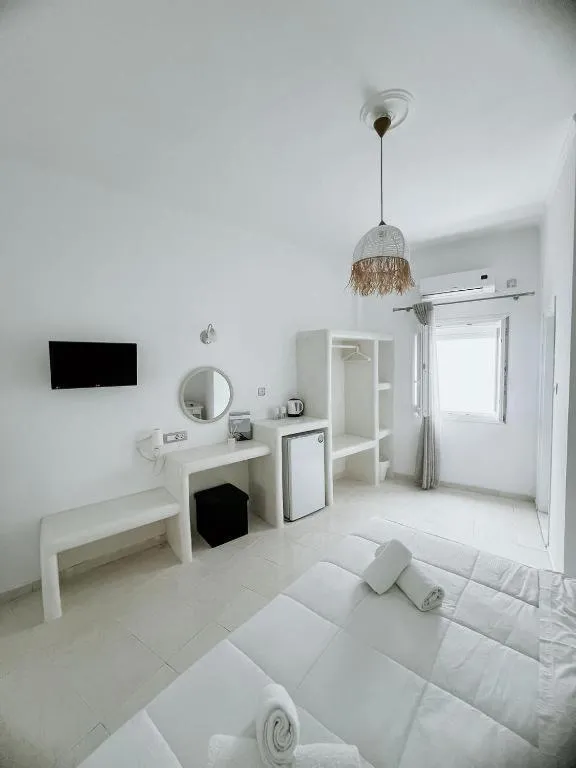 Bed in Hotel Thirasia