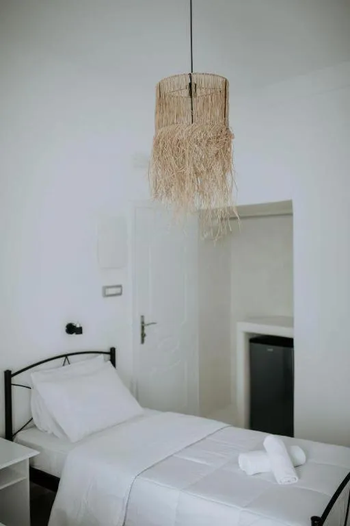 Bed in Hotel Thirasia