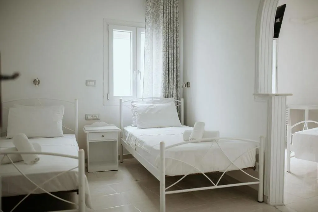 Bed in Hotel Thirasia