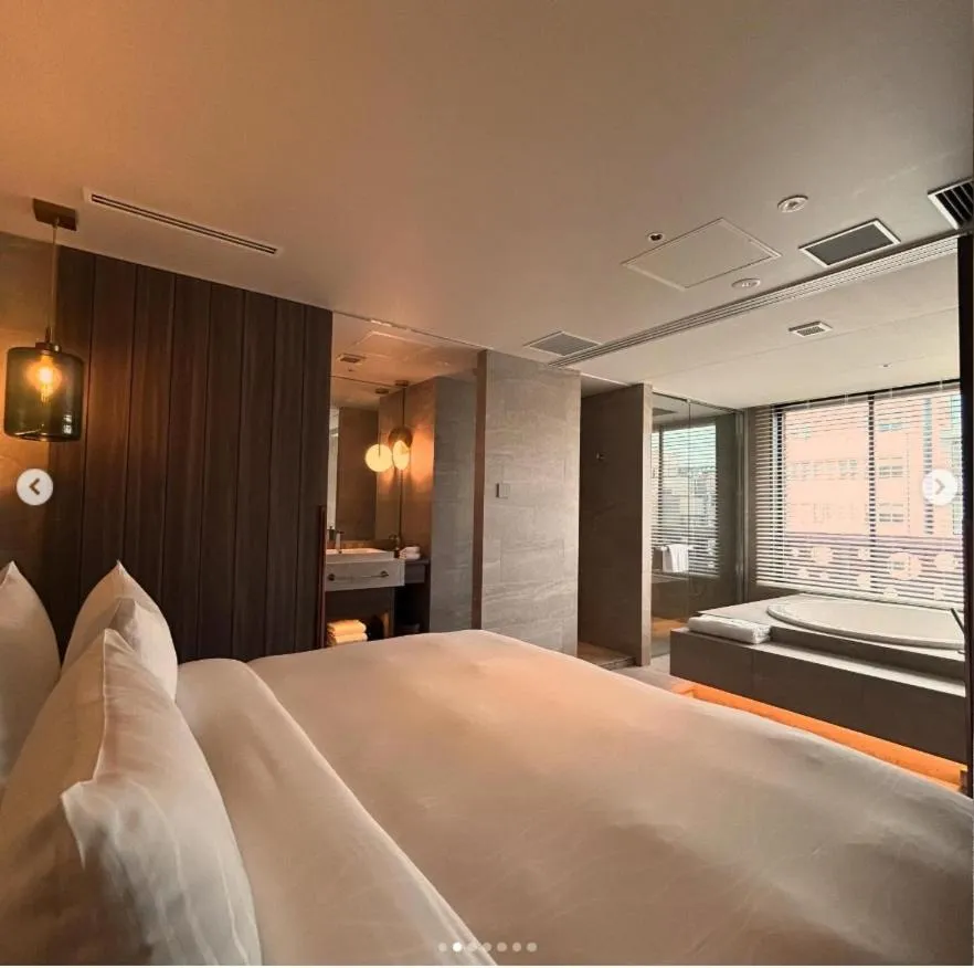 Bed in THE skM TOKYO HOTEL & DINING