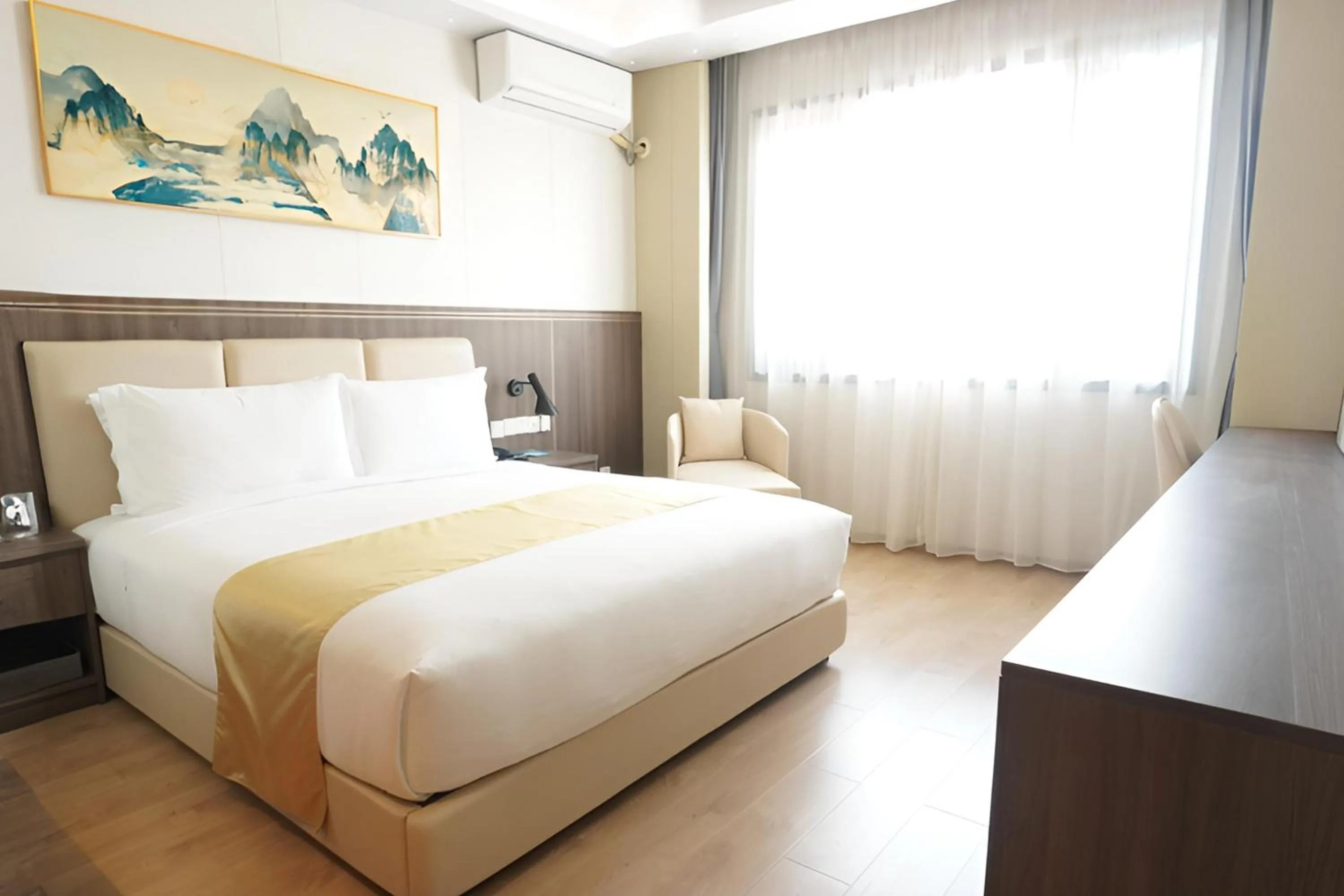 Bed in Escale International Hotel