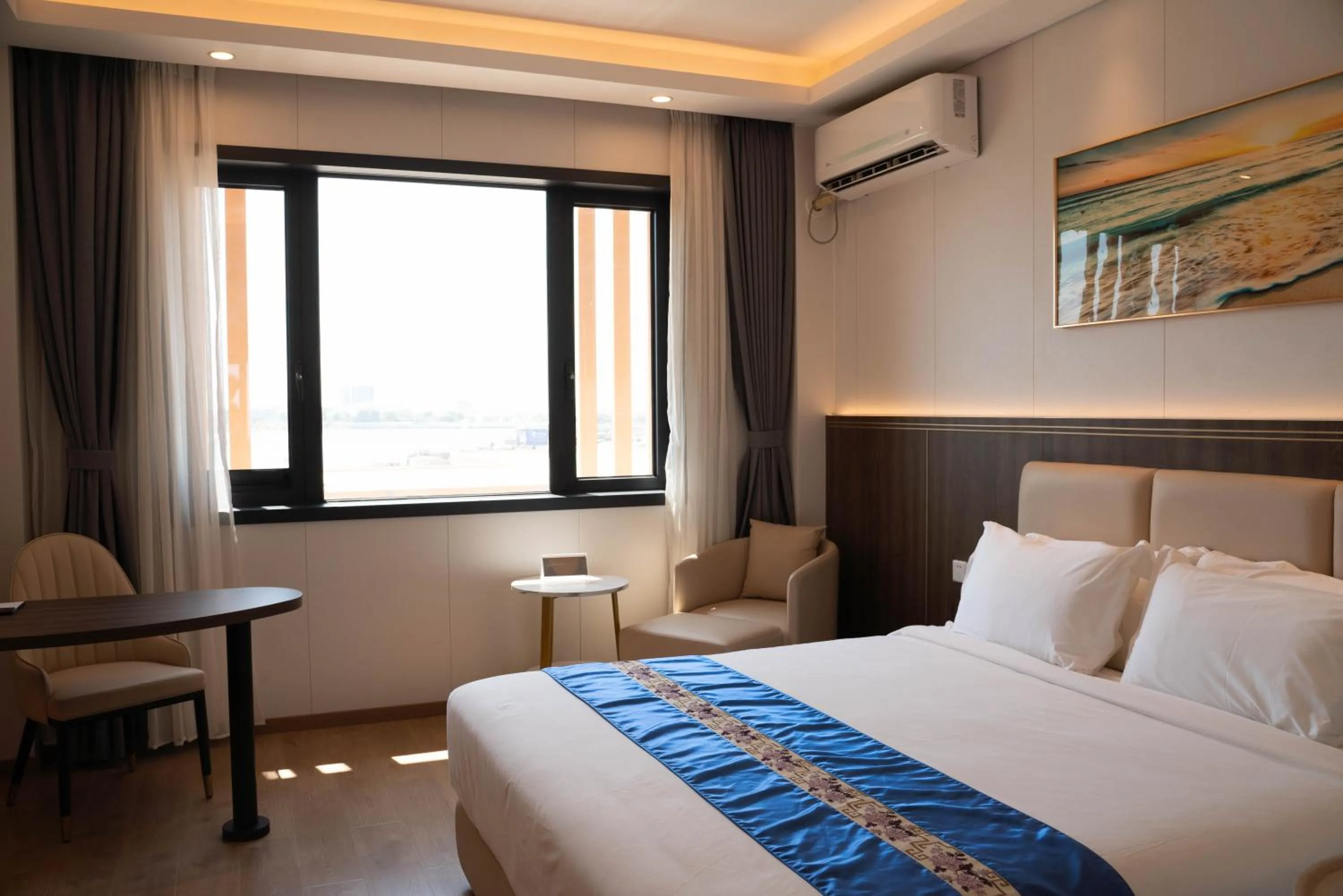 Bed in Escale International Hotel