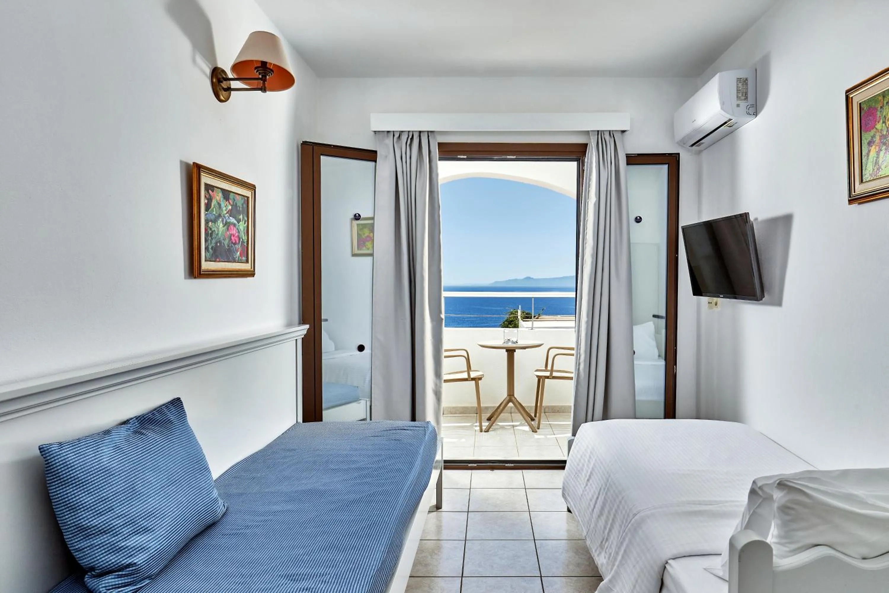 Bed in Elounda Ilion Hotel Bungalows