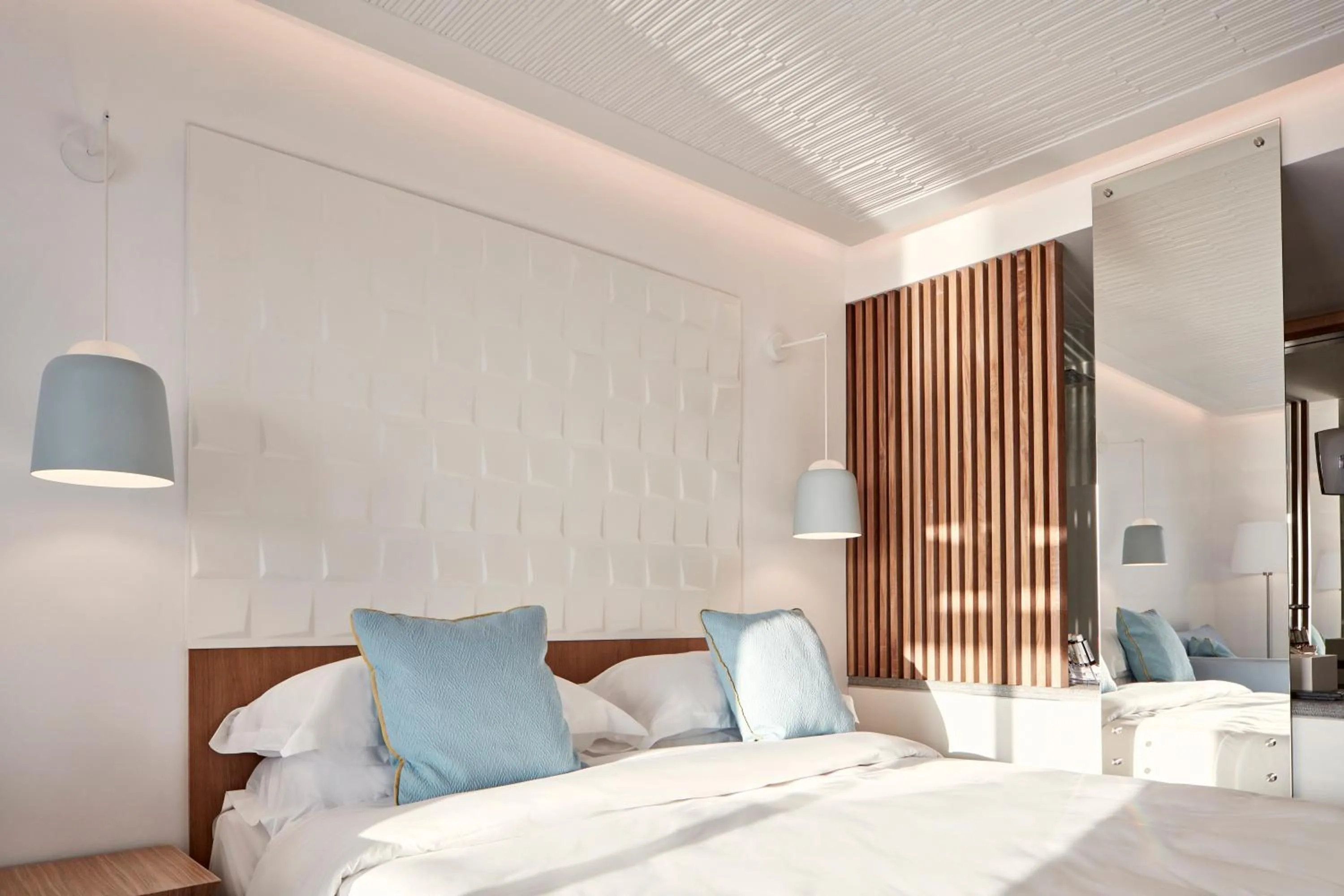 Bedroom in Myconian Korali Relais & Chateaux