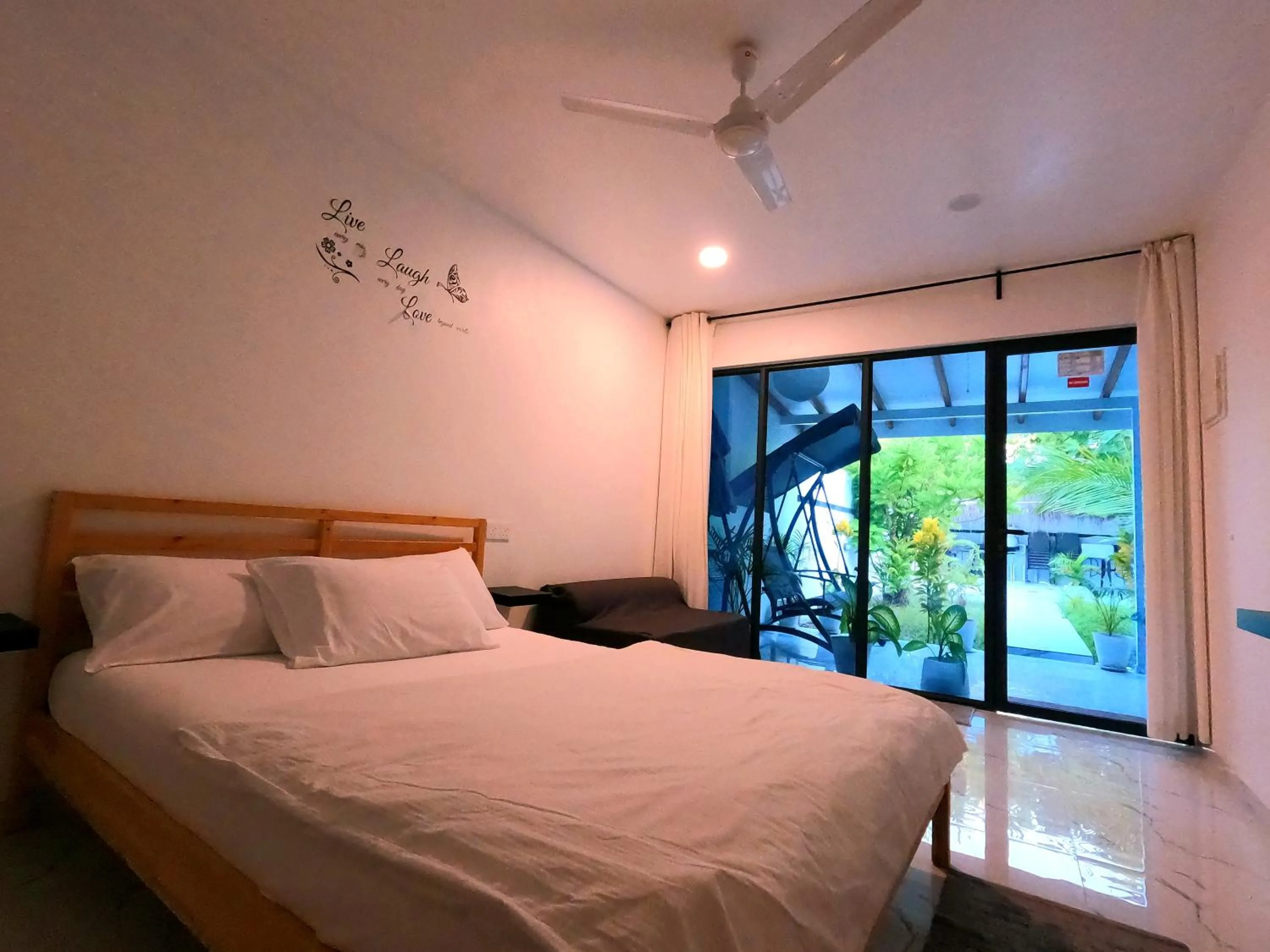 Bedroom, Bed in Oceana Inn Maldives -50 Percent off on Return Domestic Flights for Stays of 3 Nights or More