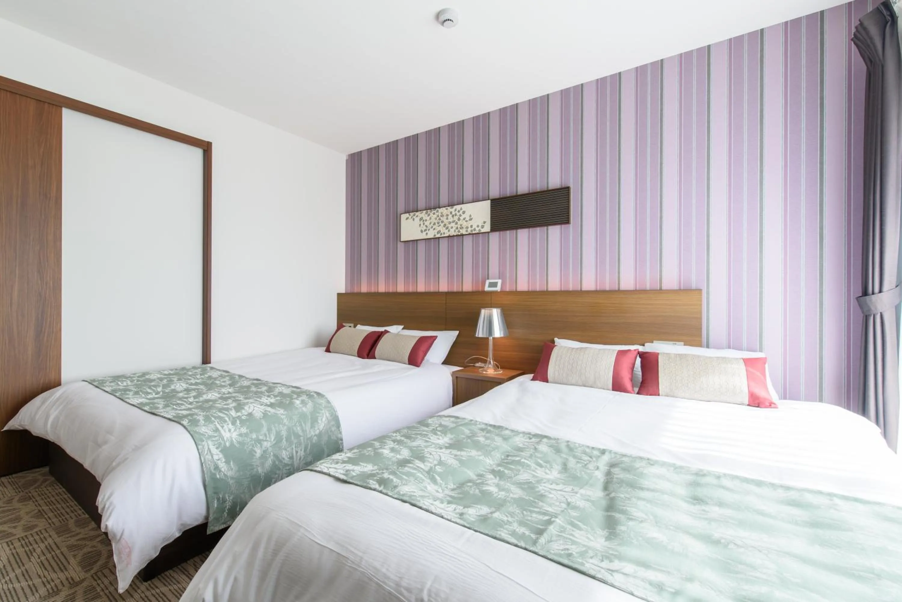 Bed in Oyado Shinmachi Gojo