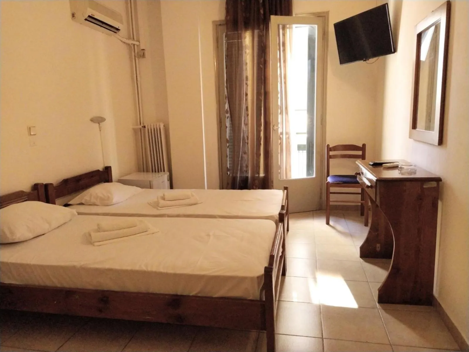 Bed in Delfini Hotel