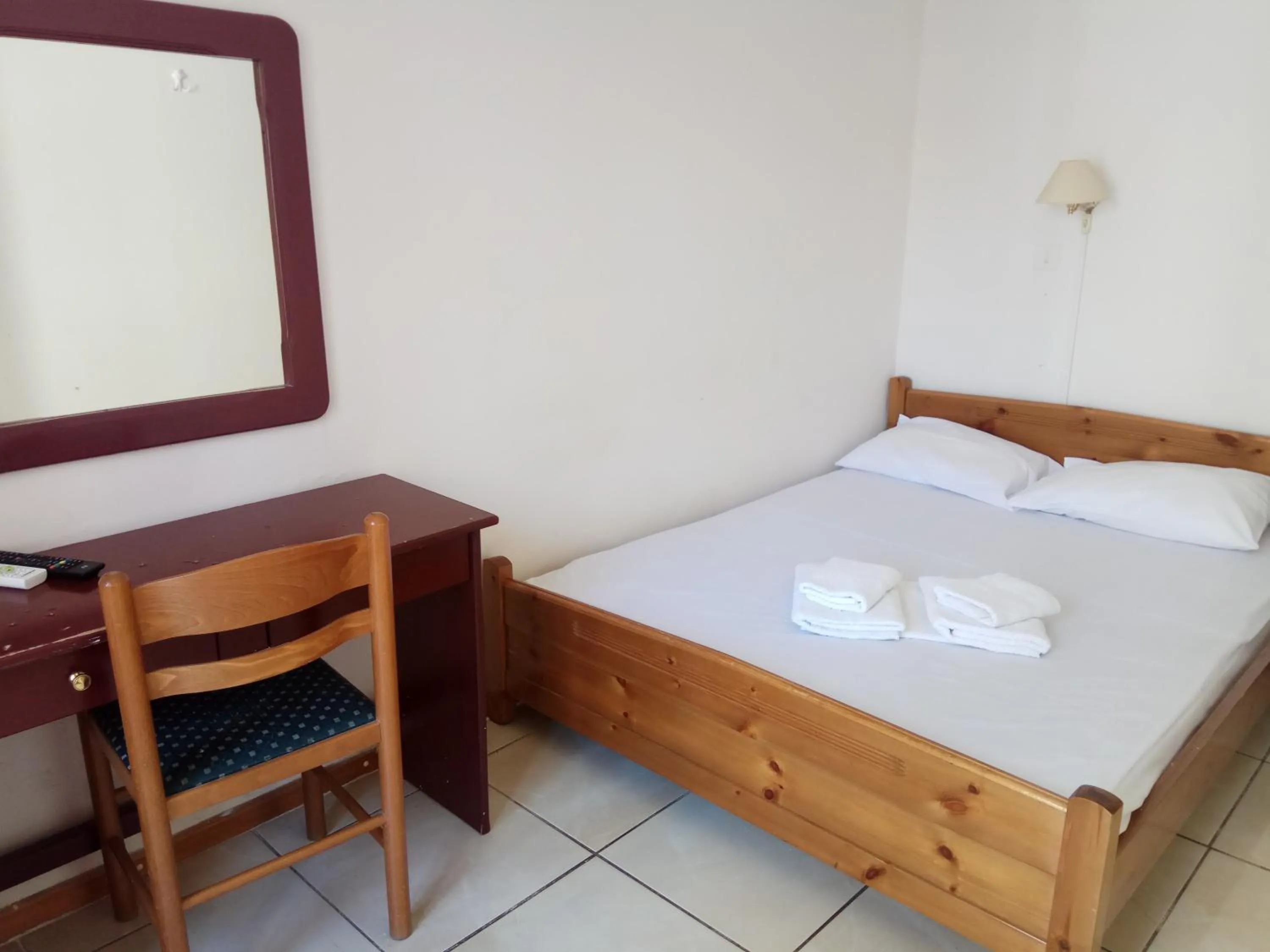 Bed in Delfini Hotel