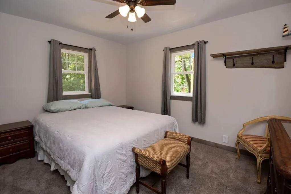 Bedroom, Bed in Little Blue Cottage: a wooded getaway near beaches and towns